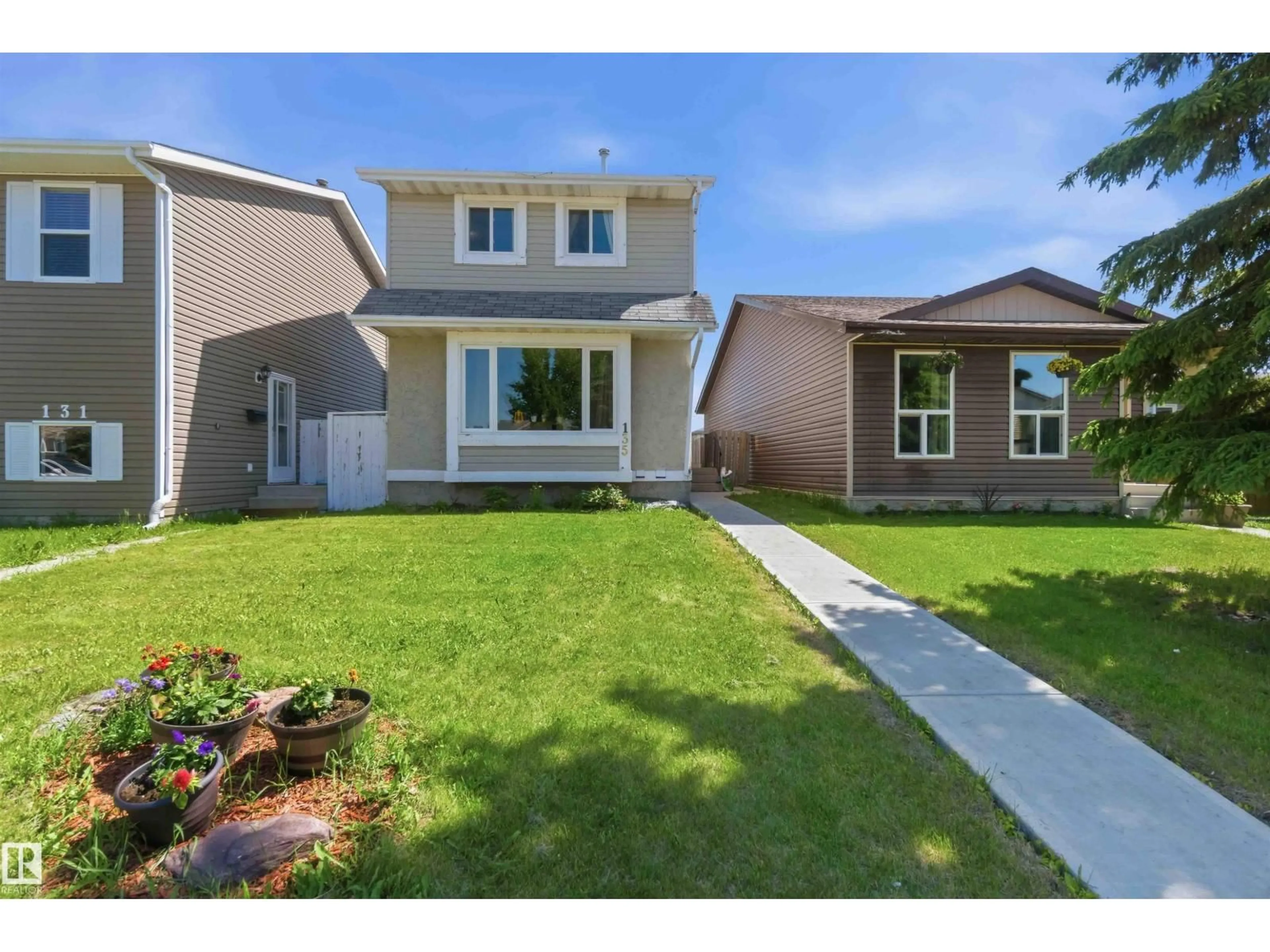 Home with vinyl exterior material, street for 135 BIRCH DR, Gibbons Alberta T0A1N0
