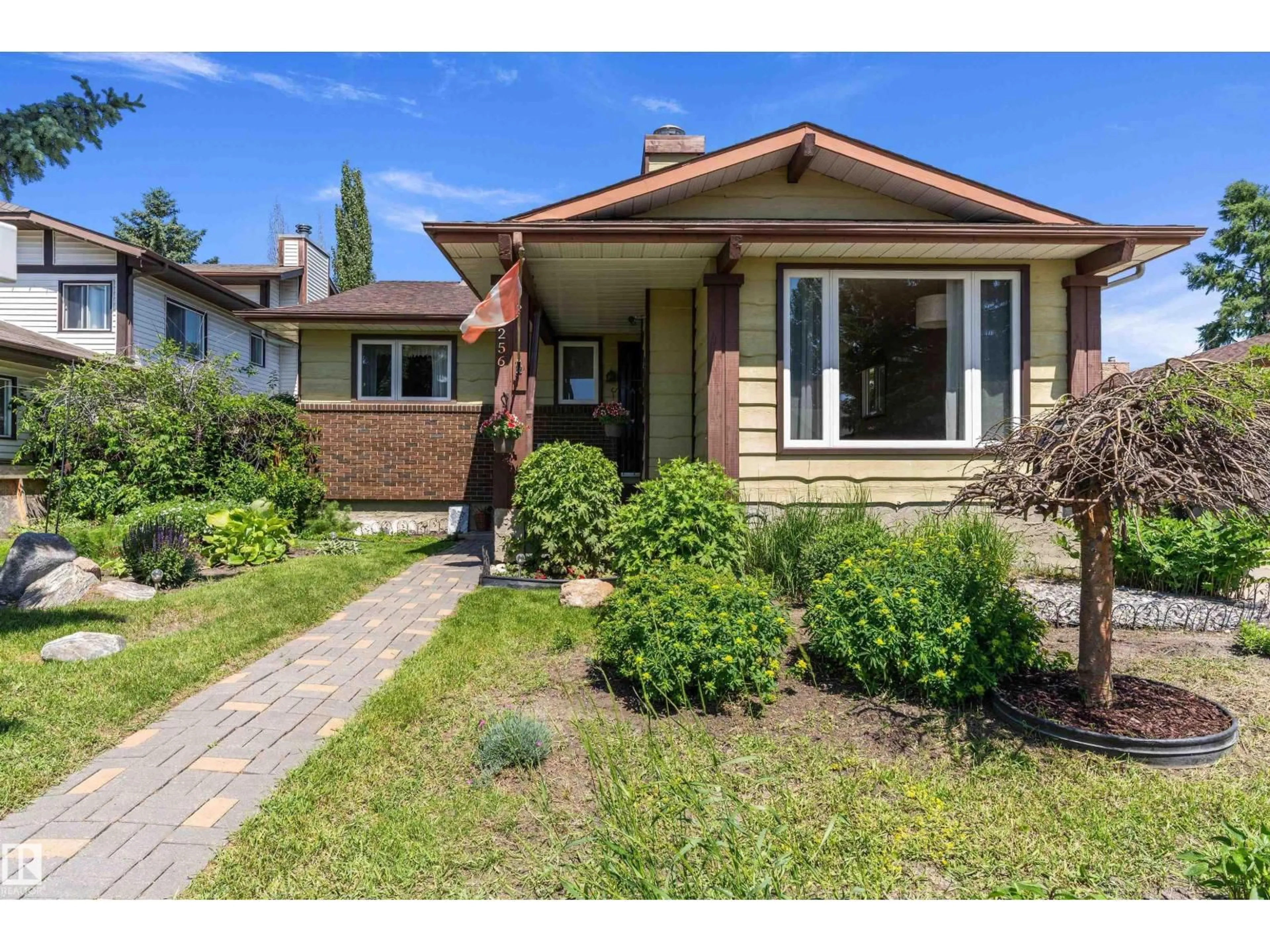 Home with brick exterior material, street for 12256 144 AV, Edmonton Alberta T5X3M4