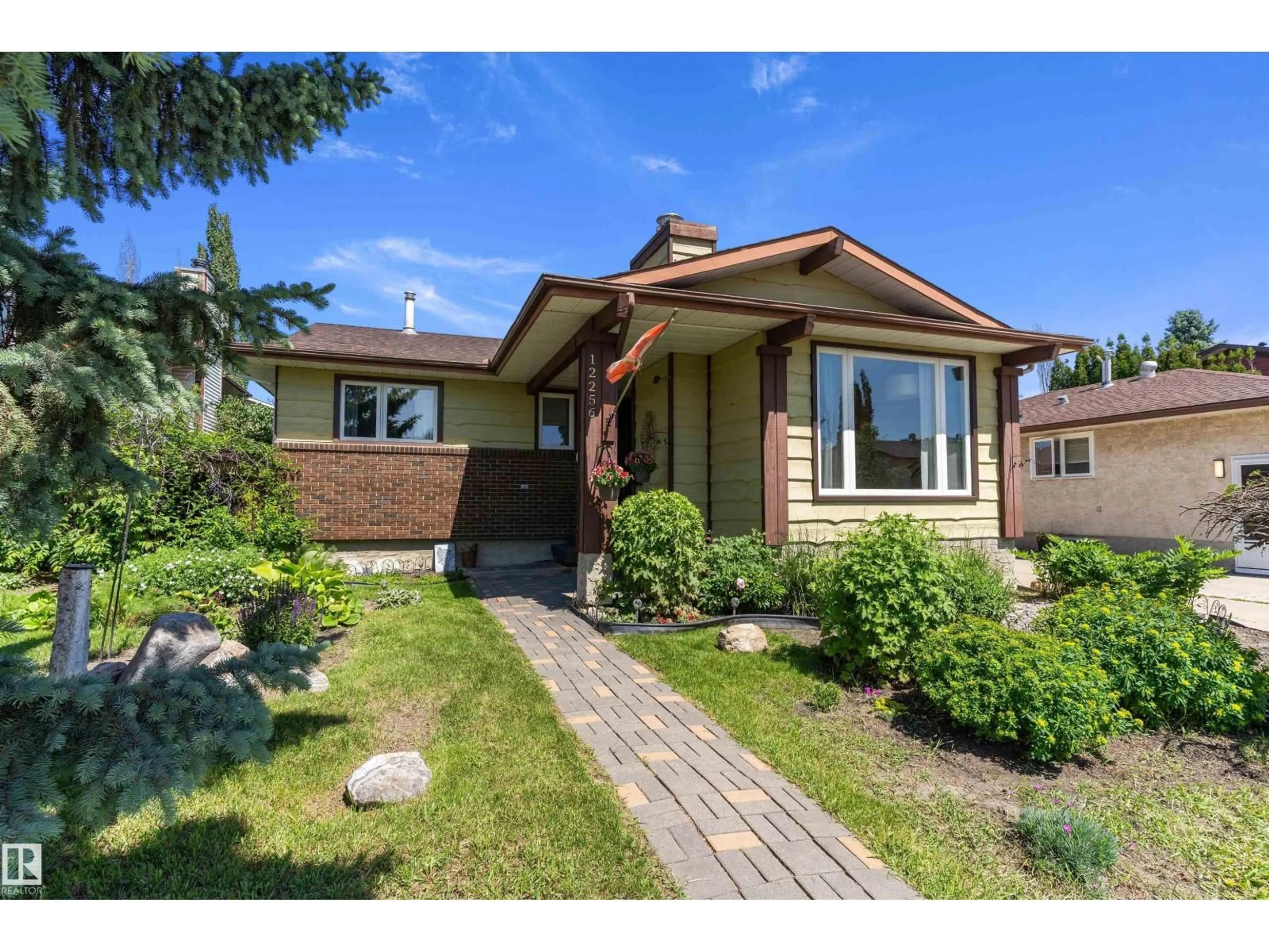 Home with brick exterior material, street for 12256 144 AV, Edmonton Alberta T5X3M4