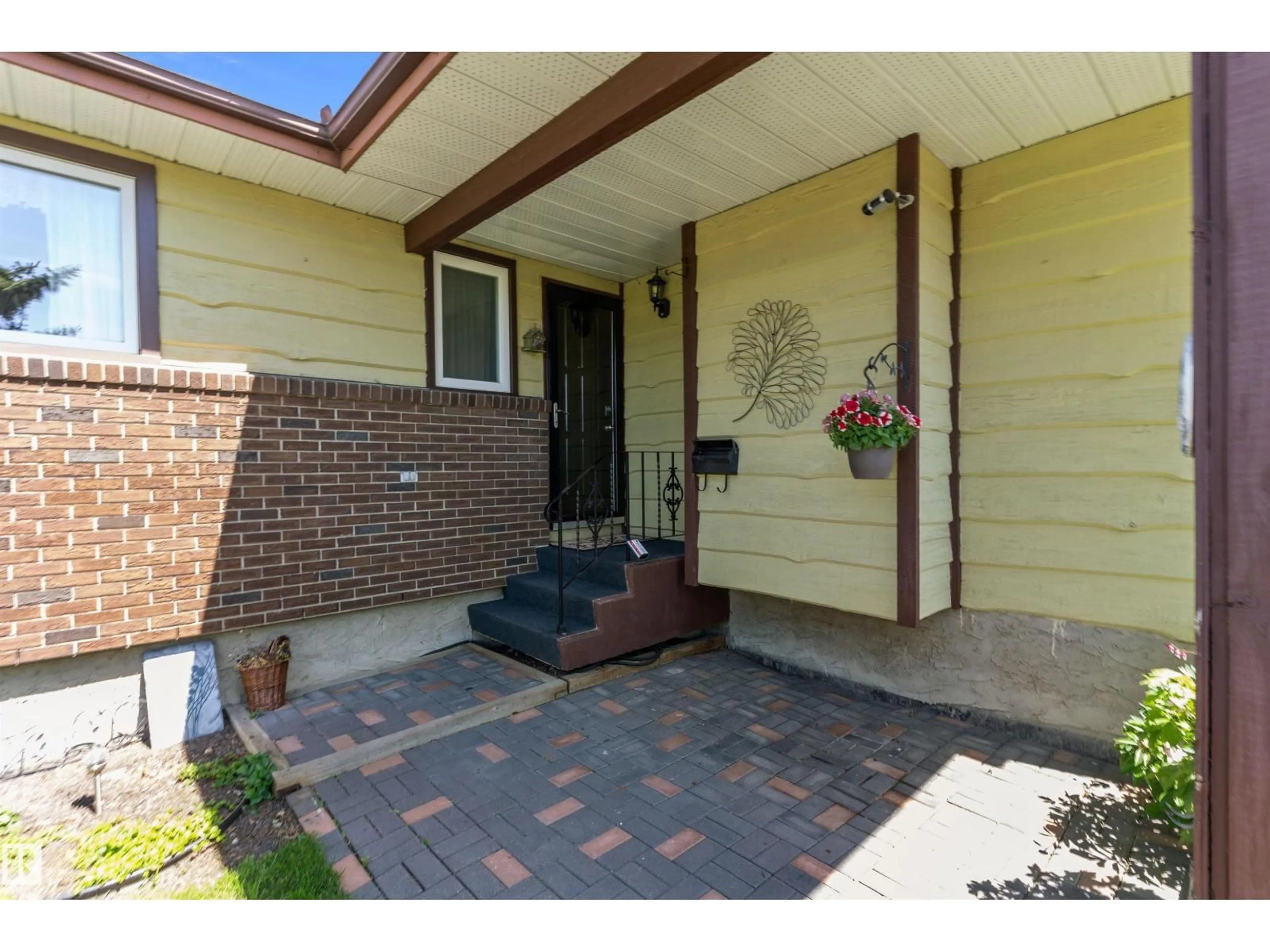 Home with brick exterior material, street for 12256 144 AV, Edmonton Alberta T5X3M4
