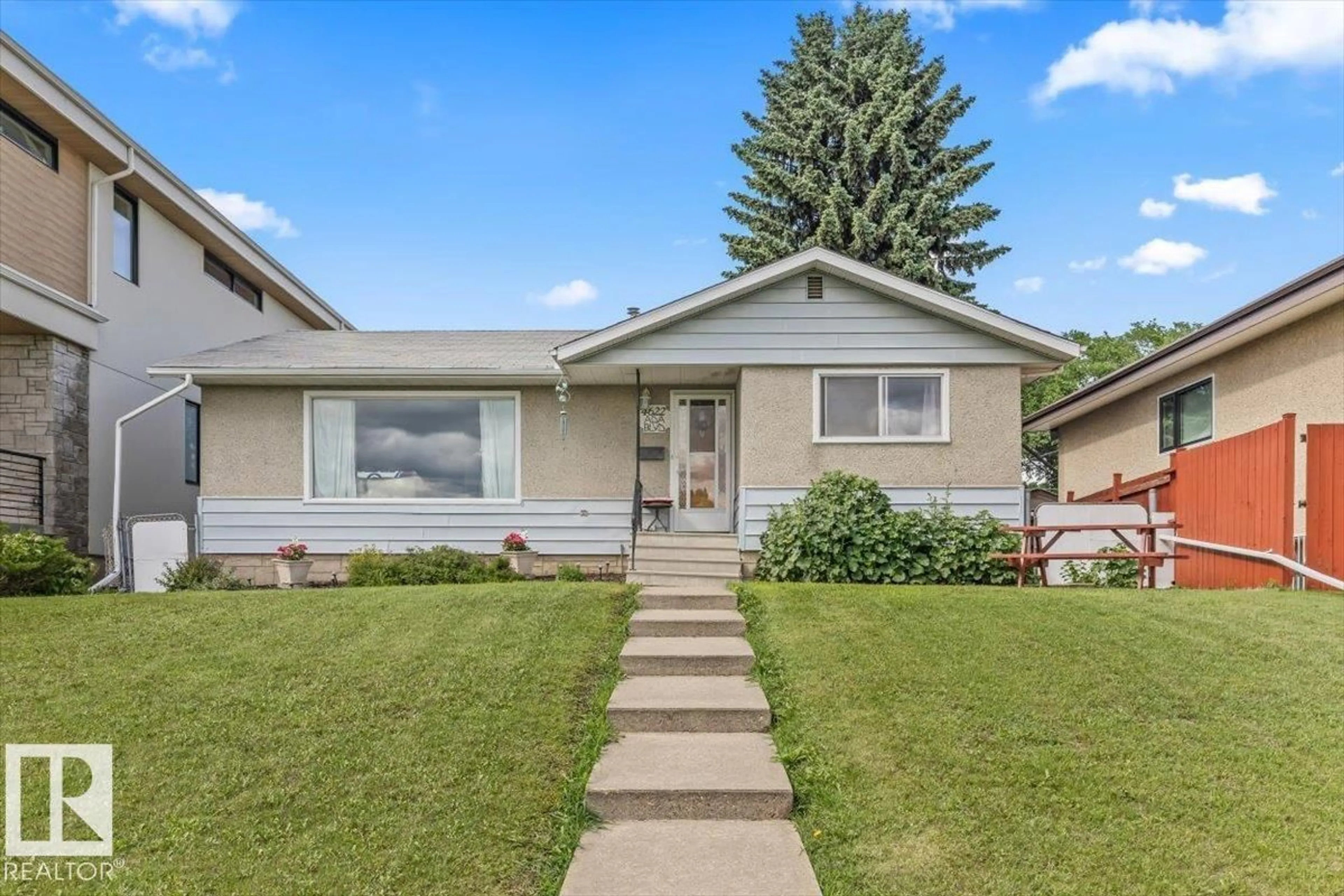 Home with vinyl exterior material, street for 4622 ADA BV, Edmonton Alberta T5W4M8