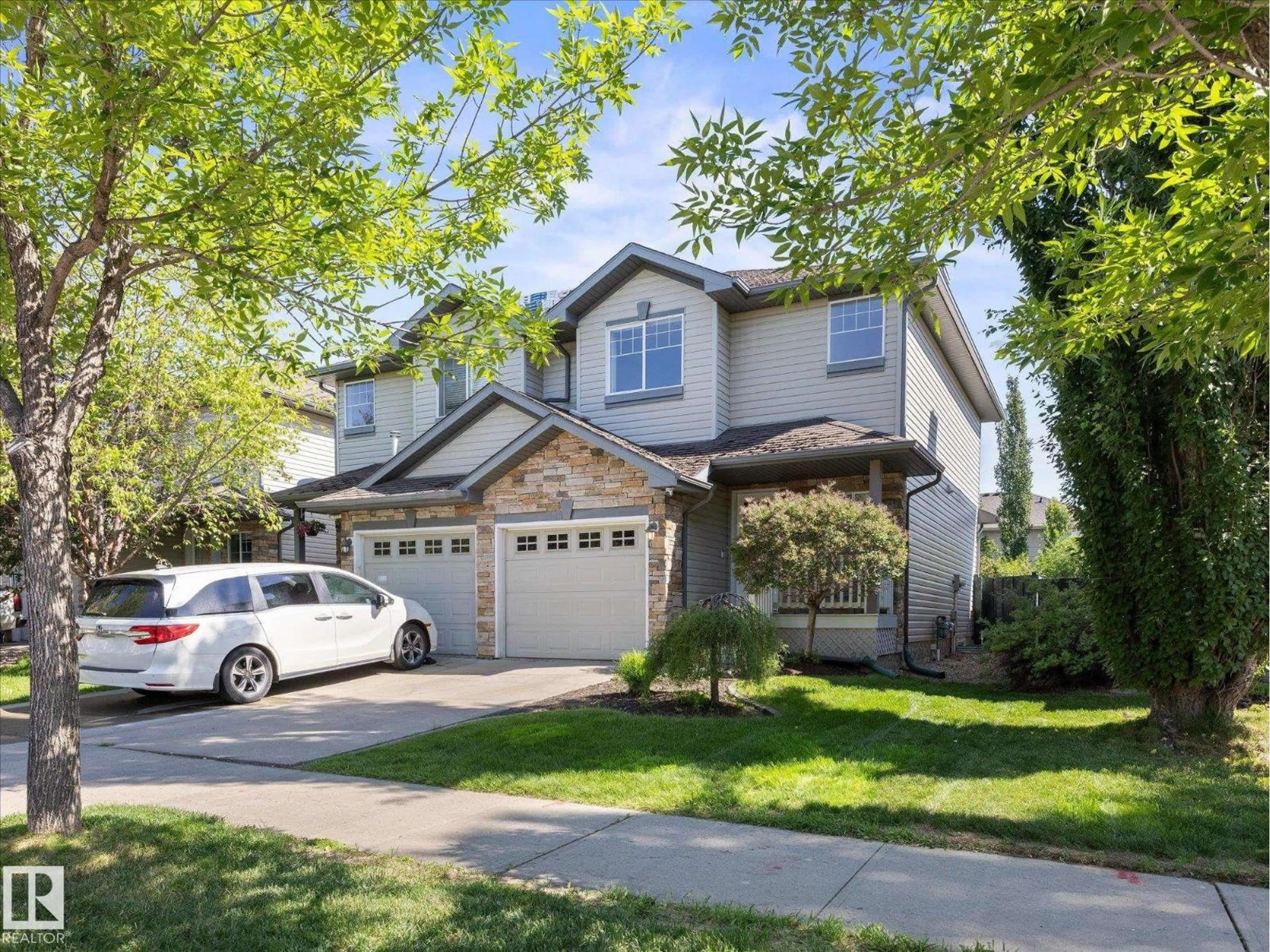 Home with vinyl exterior material, street for SW - 12126 16 AV, Edmonton Alberta T6W1L9