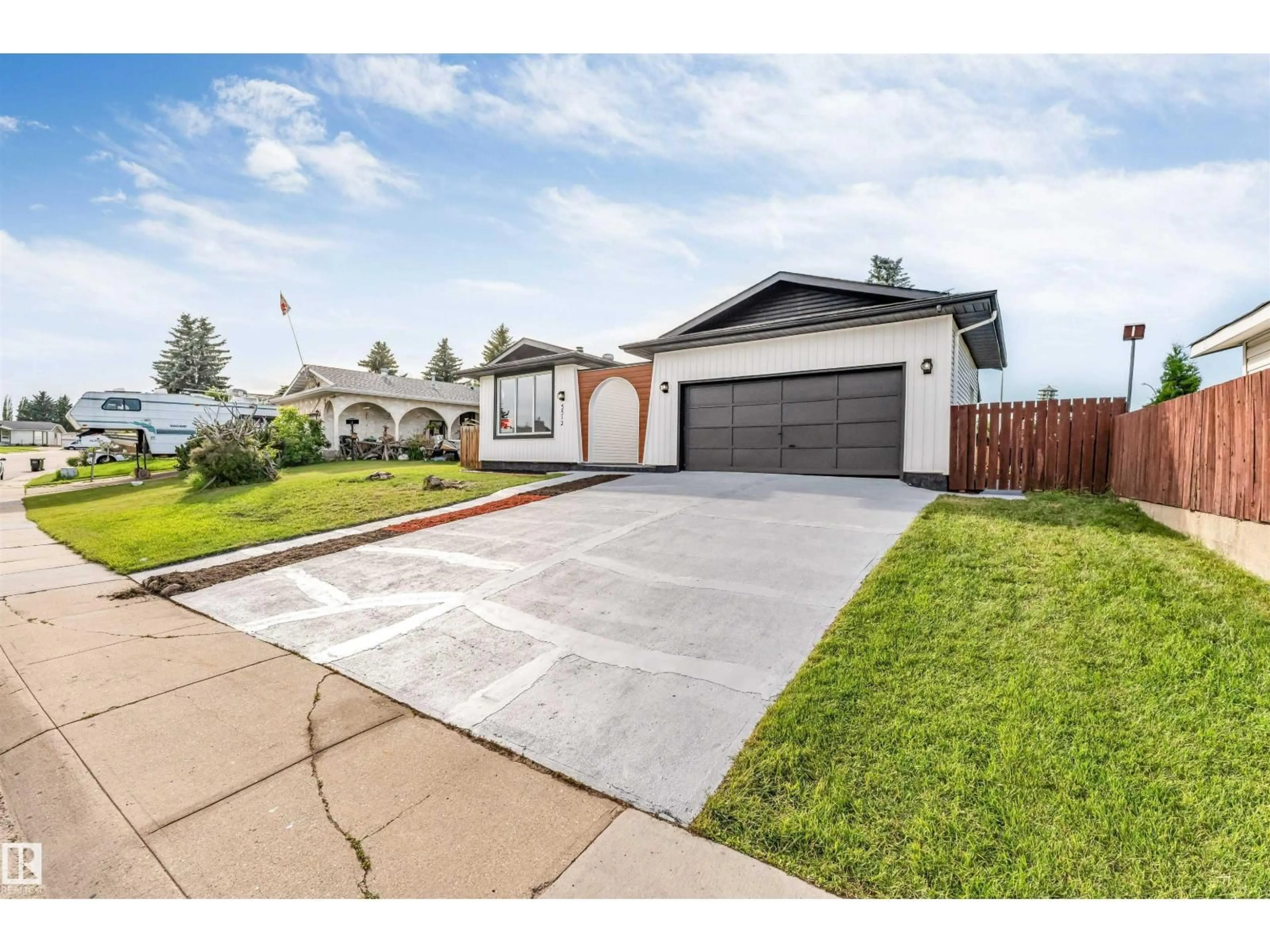Home with vinyl exterior material, street for 5512 150 AV, Edmonton Alberta T5A2L8