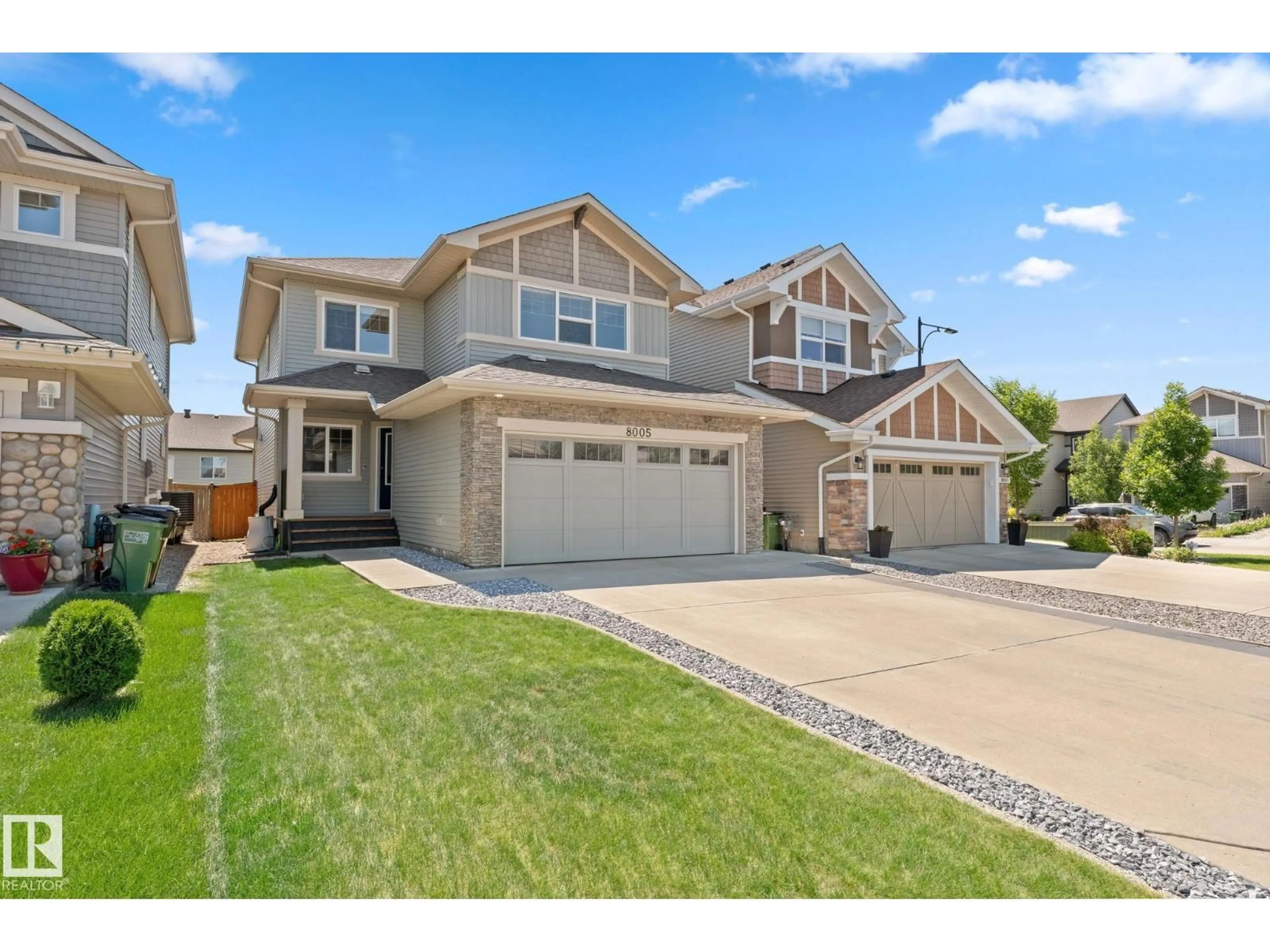 Home with vinyl exterior material, street for 8005 EVANS CR, Edmonton Alberta T6M0T7