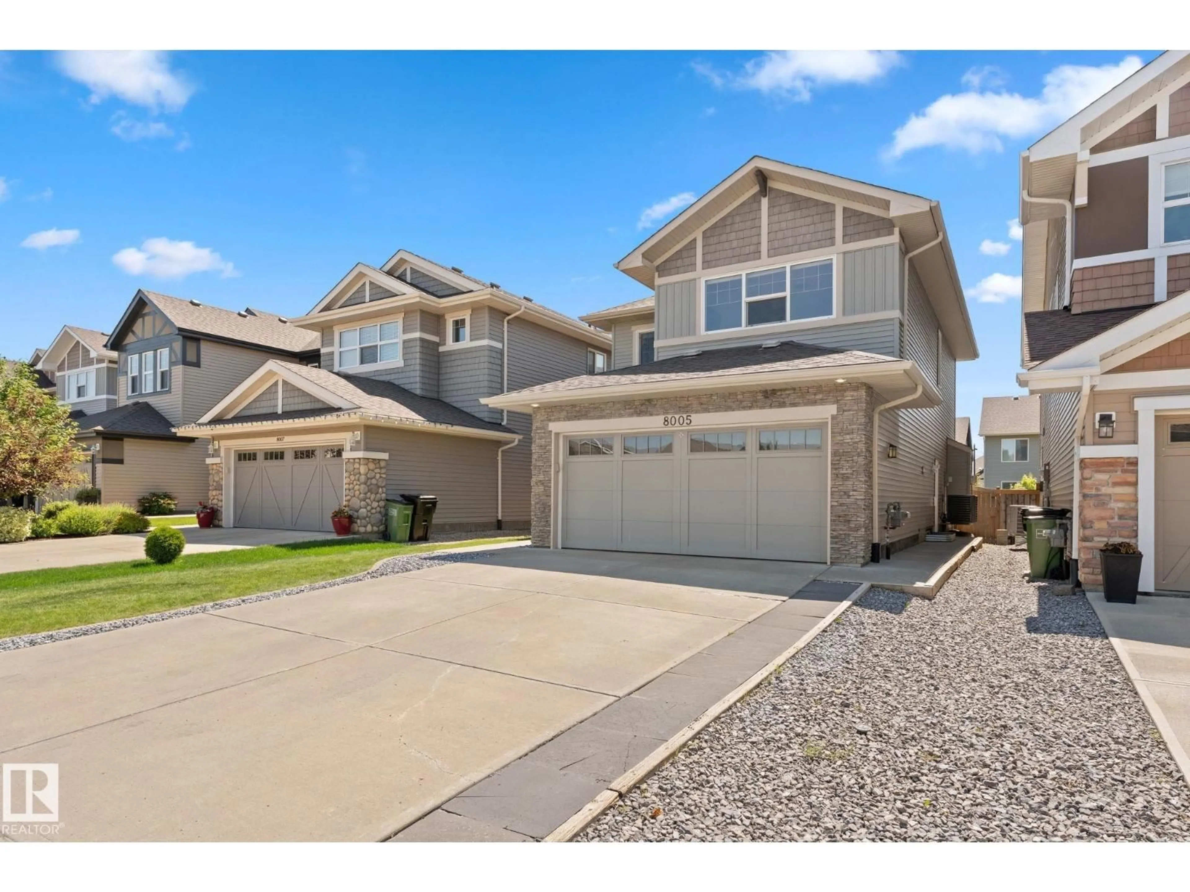 Home with vinyl exterior material, street for 8005 EVANS CR, Edmonton Alberta T6M0T7