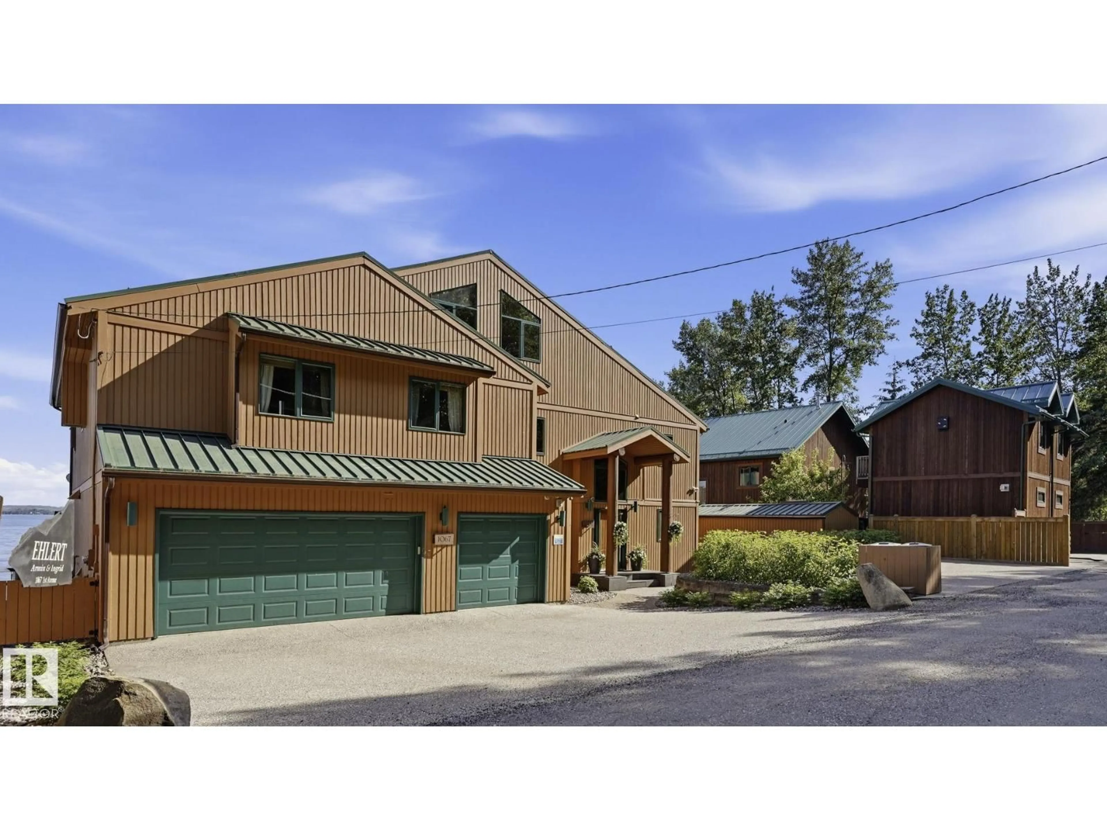 Home with brick exterior material, street for 1067 1 AV, Rural Parkland County Alberta T0E0V0
