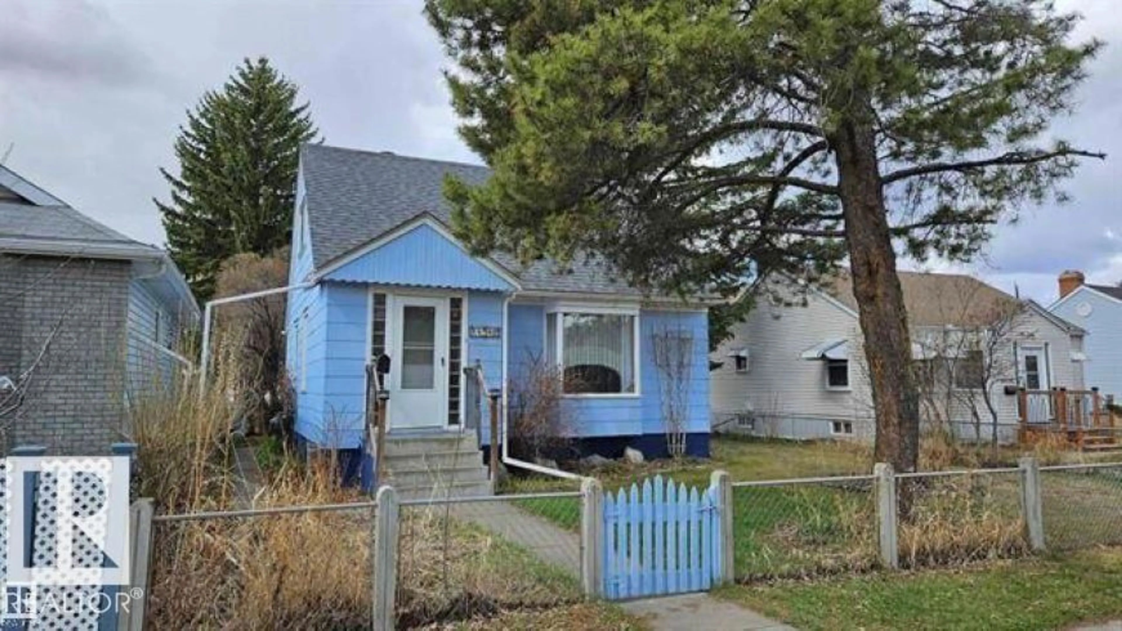 Home with vinyl exterior material, street for 11512 86 ST, Edmonton Alberta T5B3J5