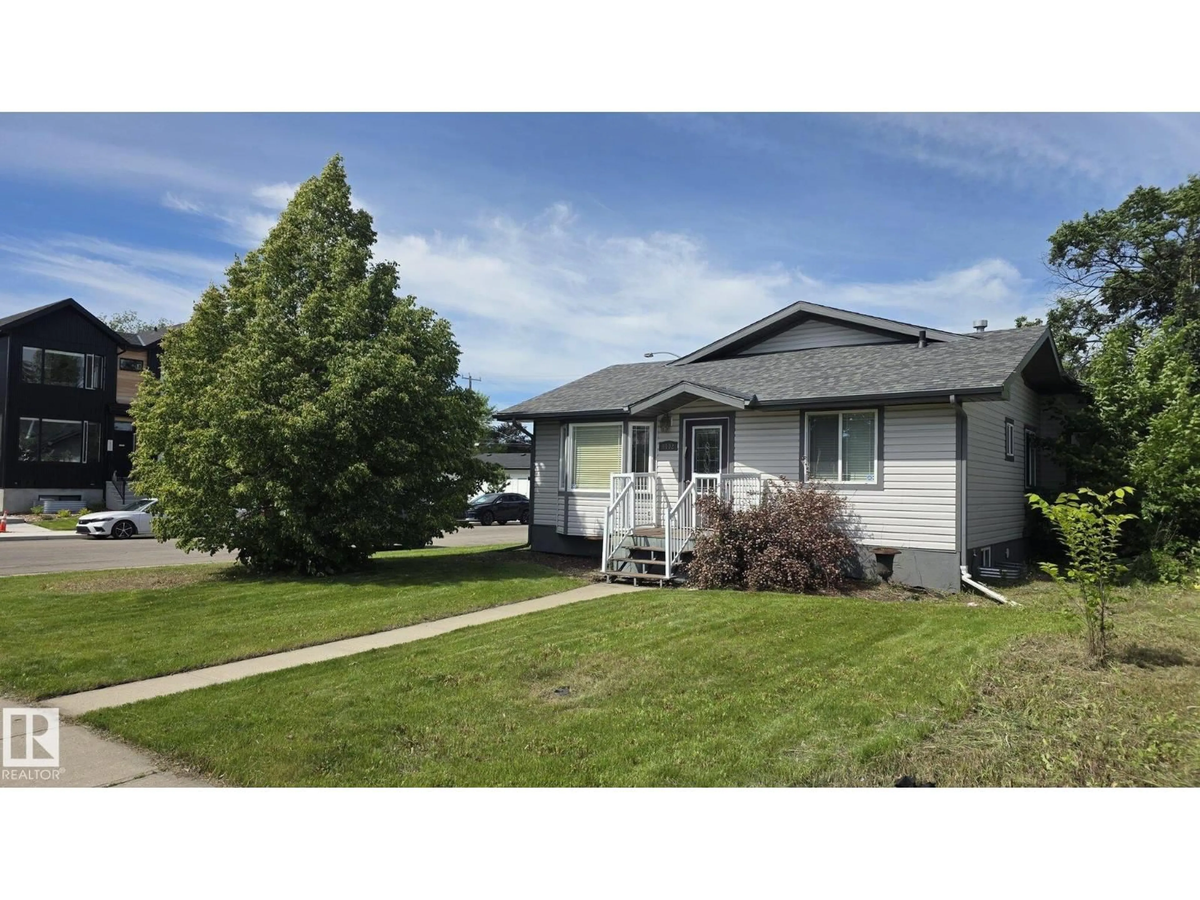 Home with vinyl exterior material, street for NW - 9402 153 ST, Edmonton Alberta T5R1R3