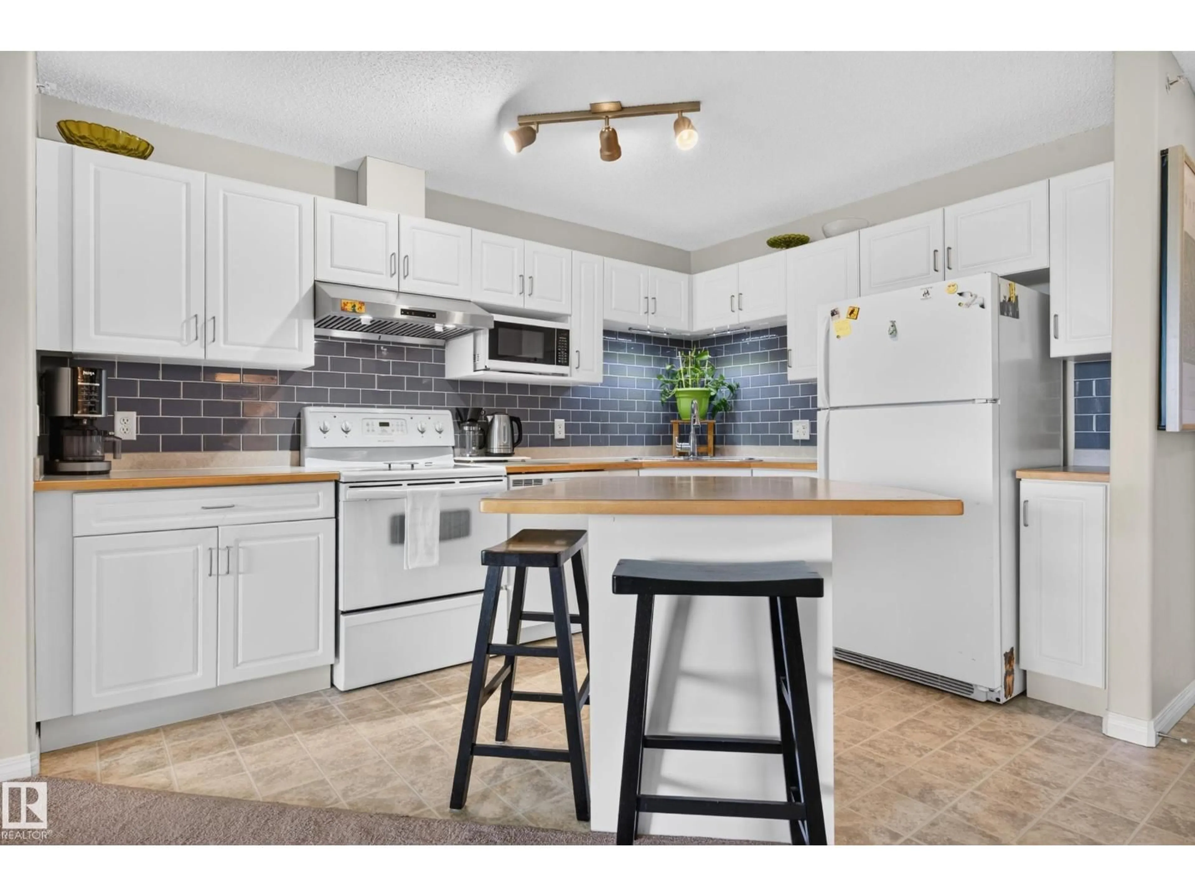 Open concept kitchen, unknown for 526 11325 83 ST NW, Edmonton Alberta T5B4W5