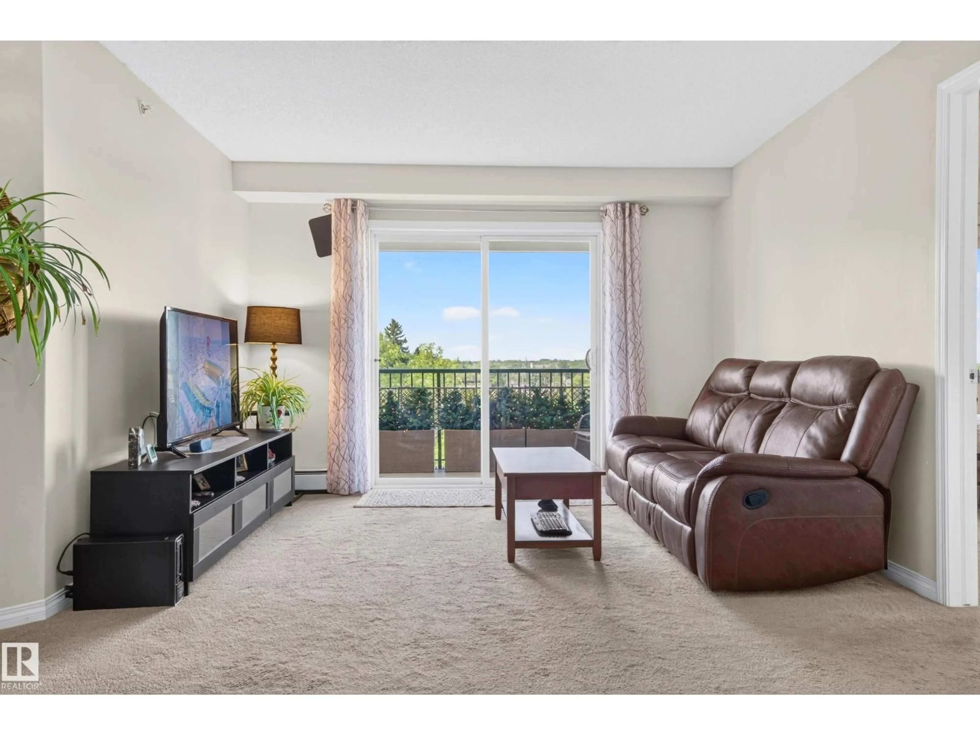 Living room with furniture, unknown for 526 11325 83 ST NW, Edmonton Alberta T5B4W5
