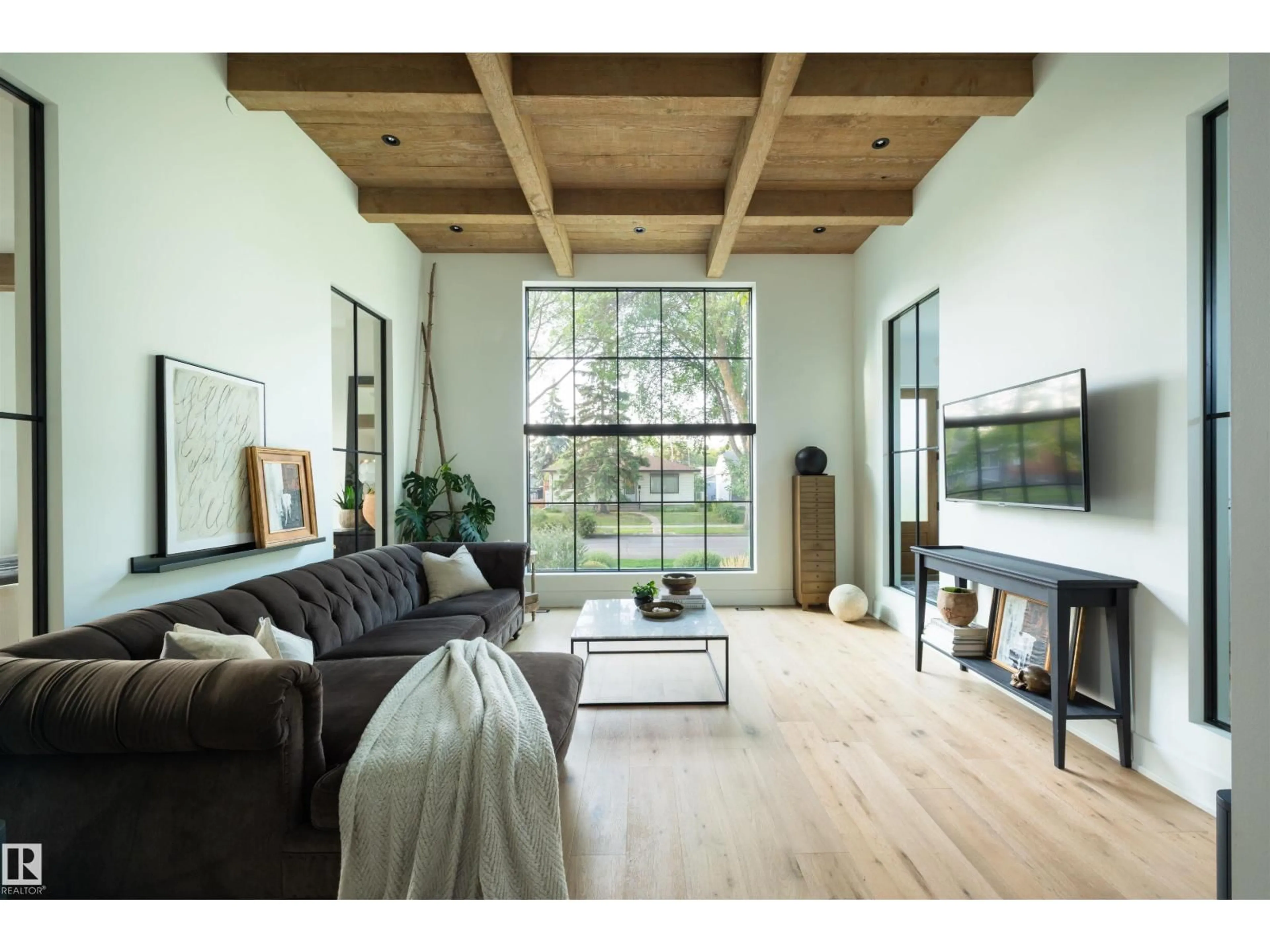 Living room with furniture, wood/laminate floor for NW - 8102 92 AV, Edmonton Alberta T6C1R8
