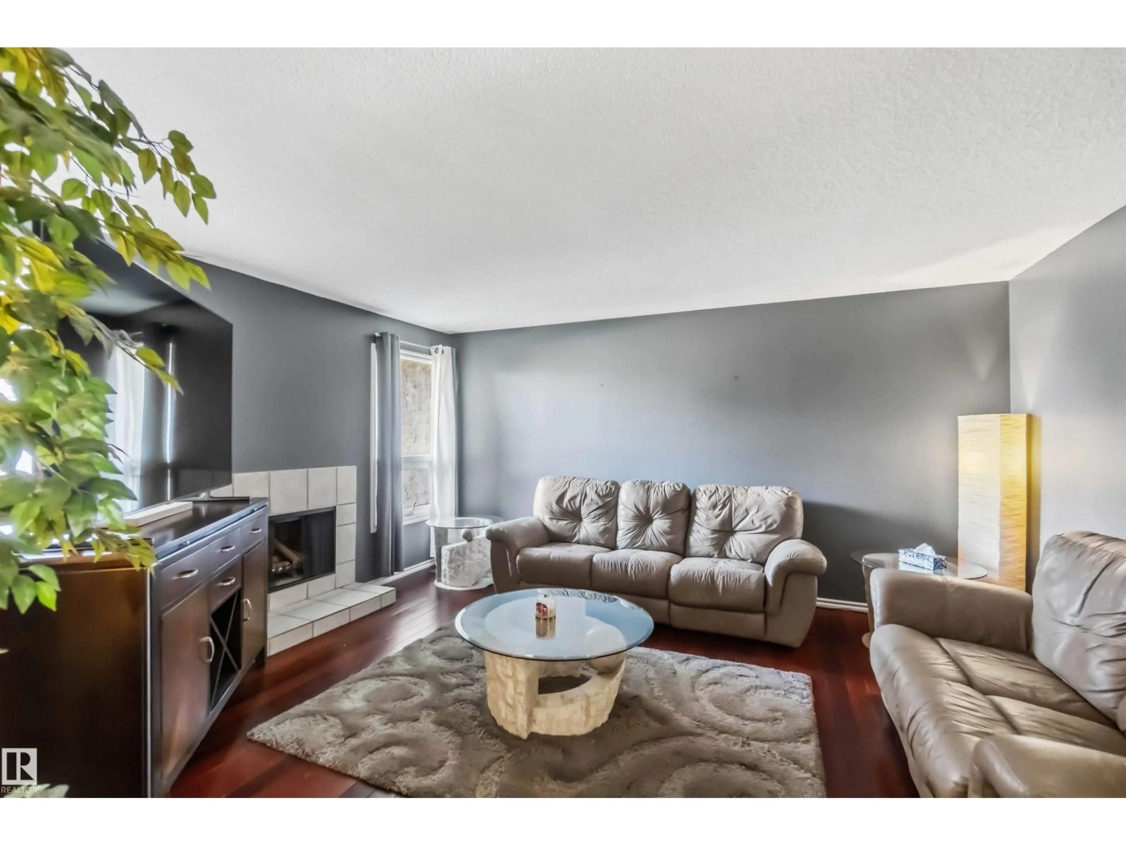Living room with furniture, wood/laminate floor for NW - 14121 23 ST, Edmonton Alberta T5Y1P9