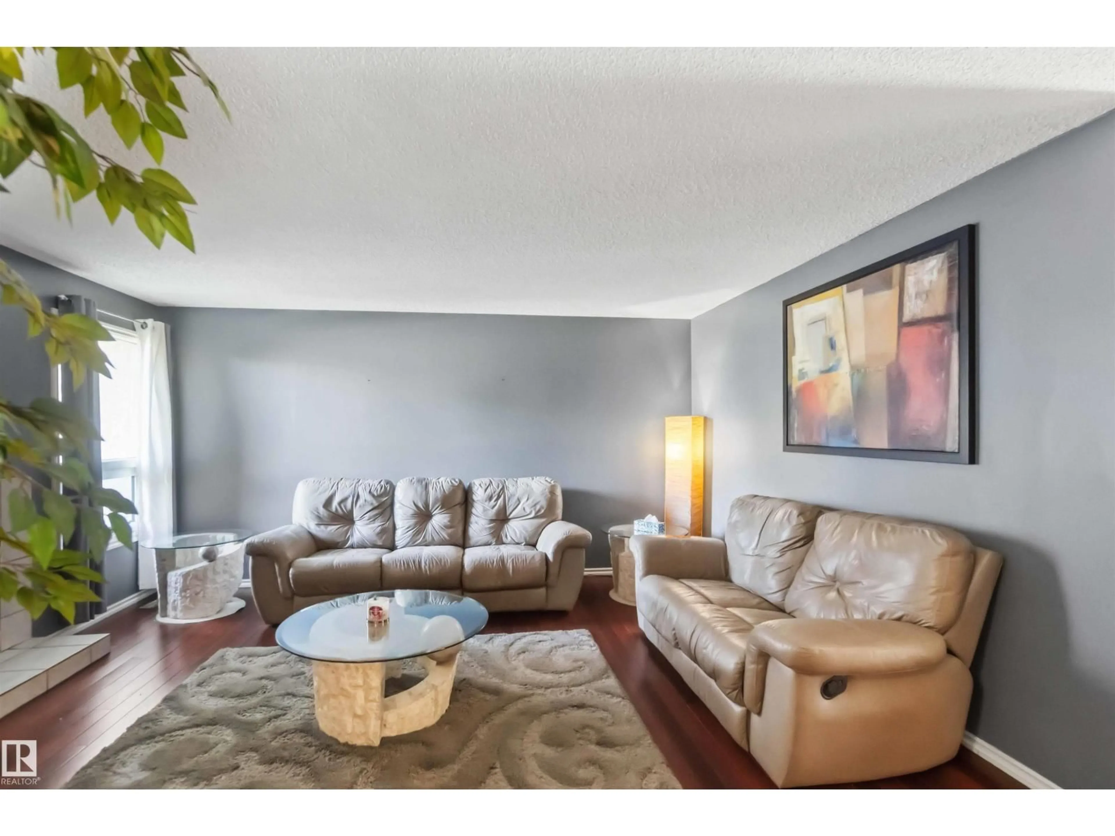 Living room with furniture, wood/laminate floor for NW - 14121 23 ST, Edmonton Alberta T5Y1P9