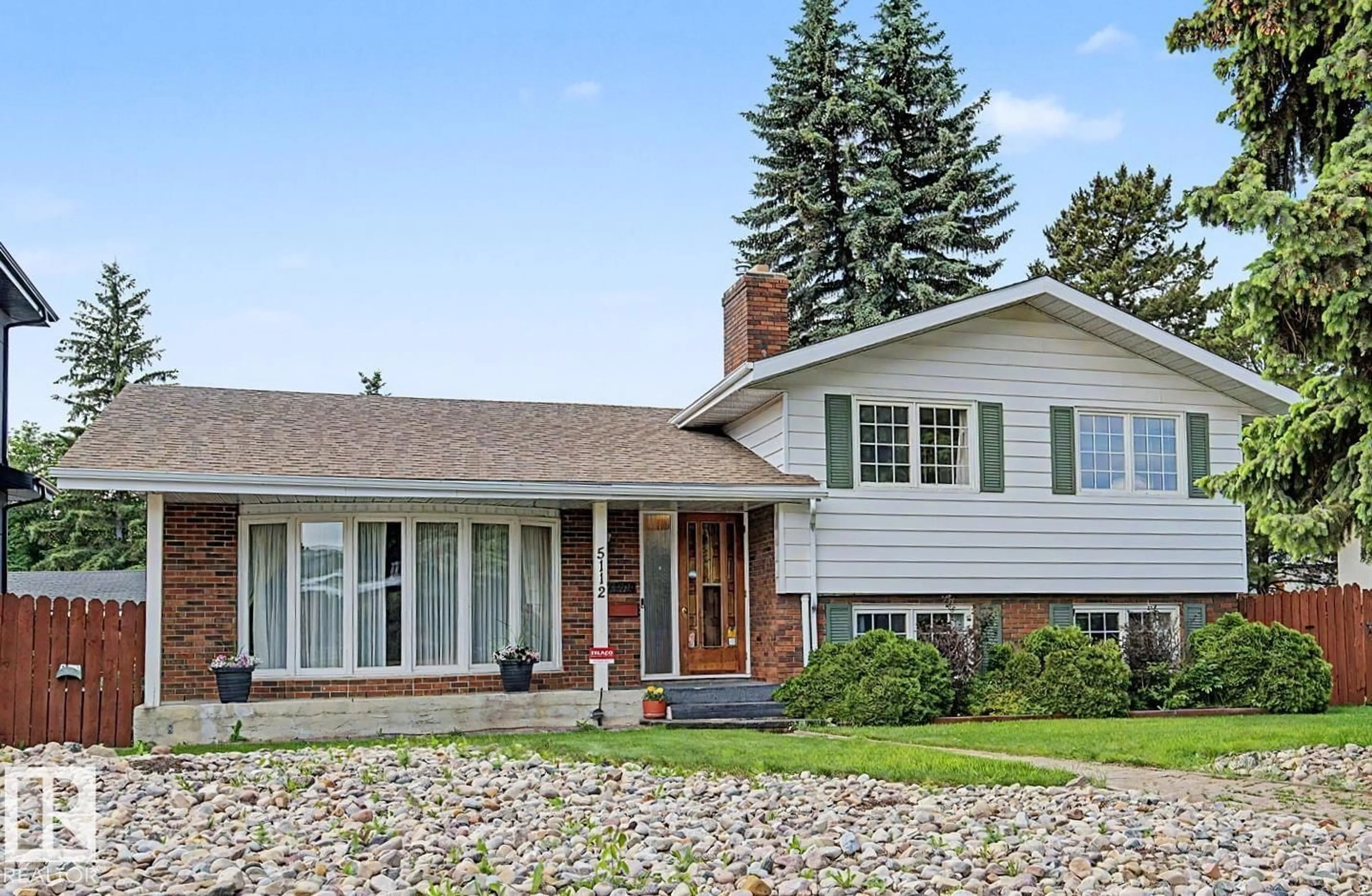 Home with vinyl exterior material, street for 5112 143 ST, Edmonton Alberta T6H4E2