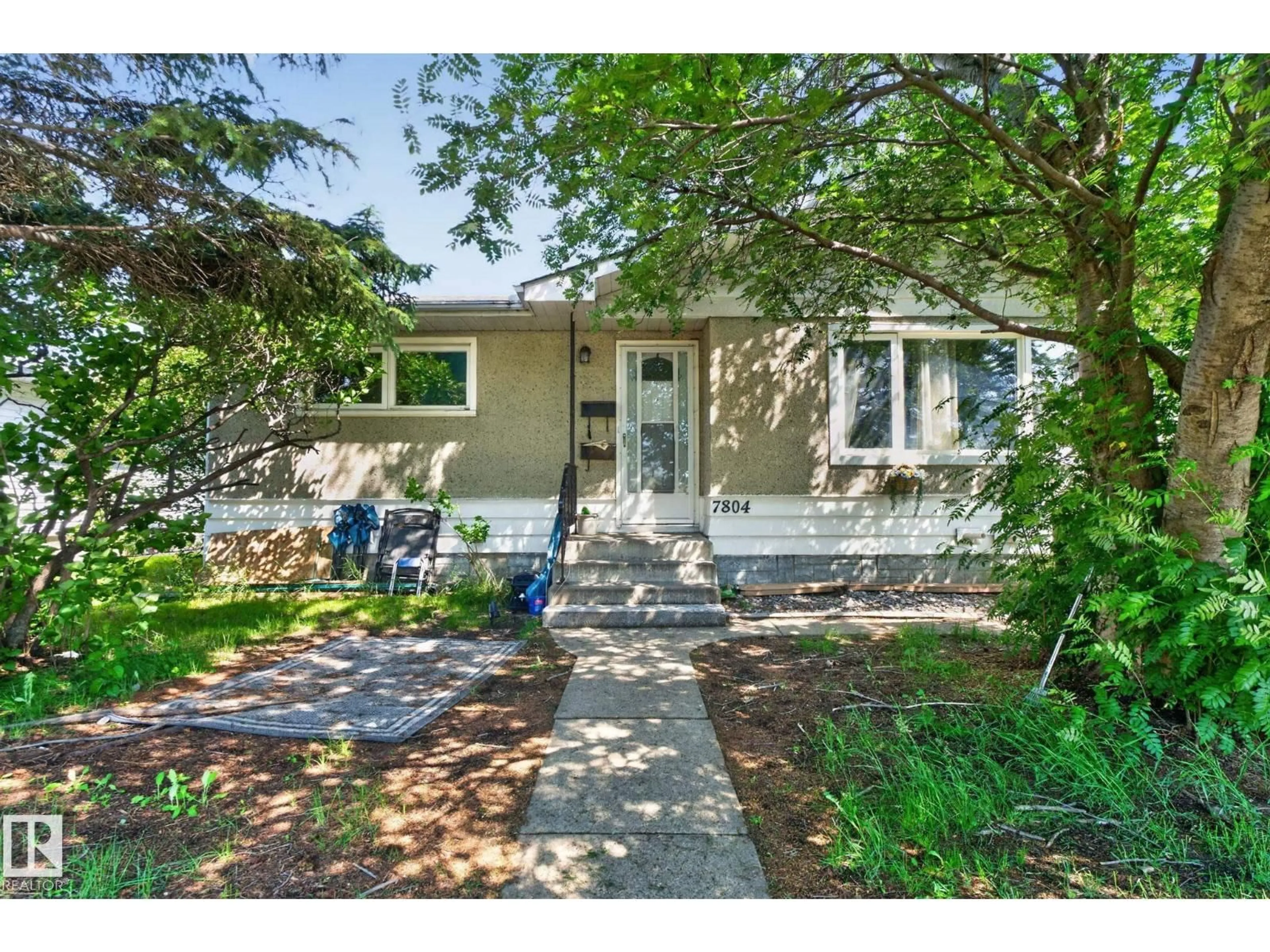 Home with vinyl exterior material, street for 7804 136 AV NW, Edmonton Alberta T5C2K5