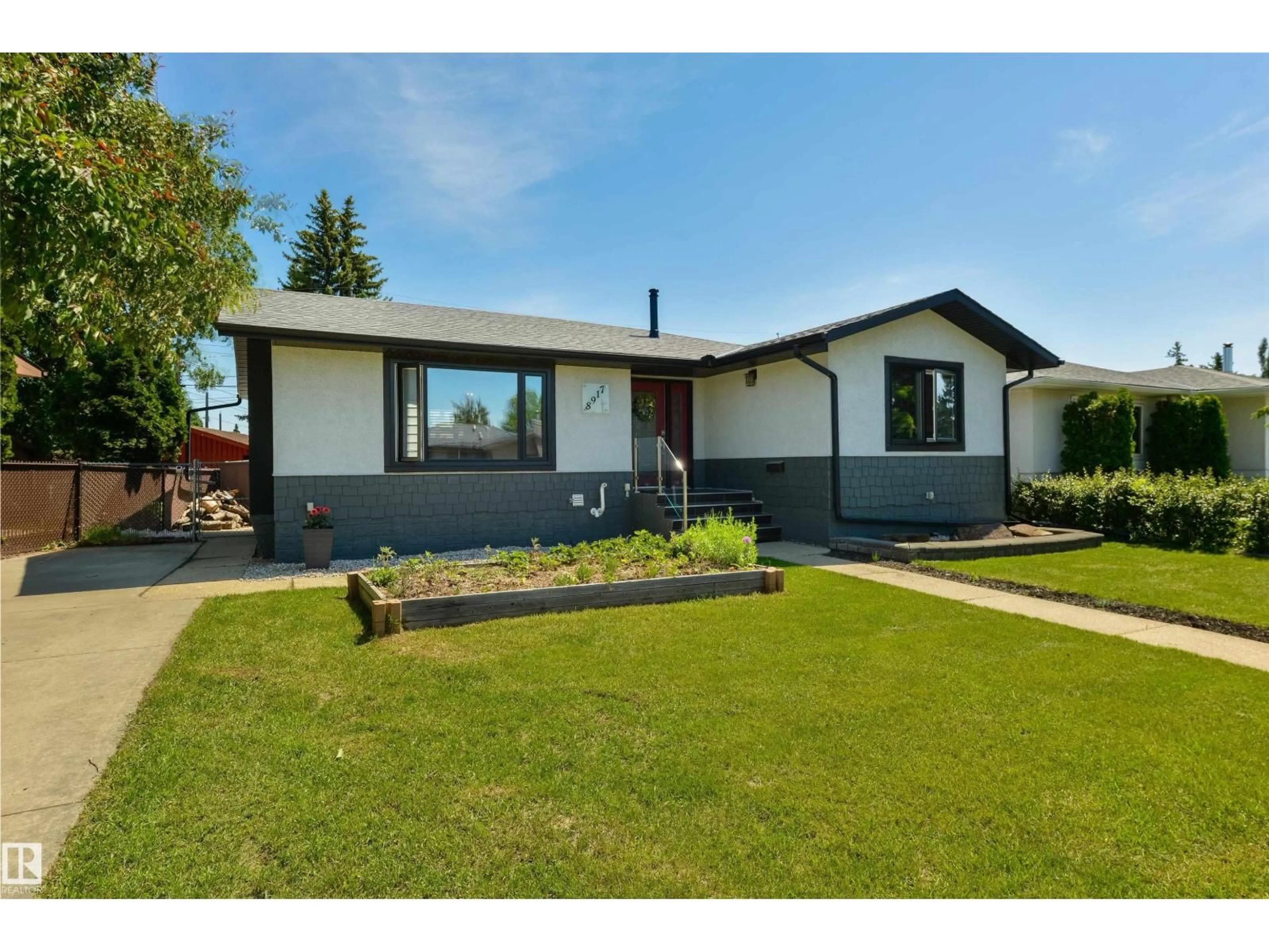 Home with vinyl exterior material, street for 8917 162 ST NW, Edmonton Alberta T5R2M5
