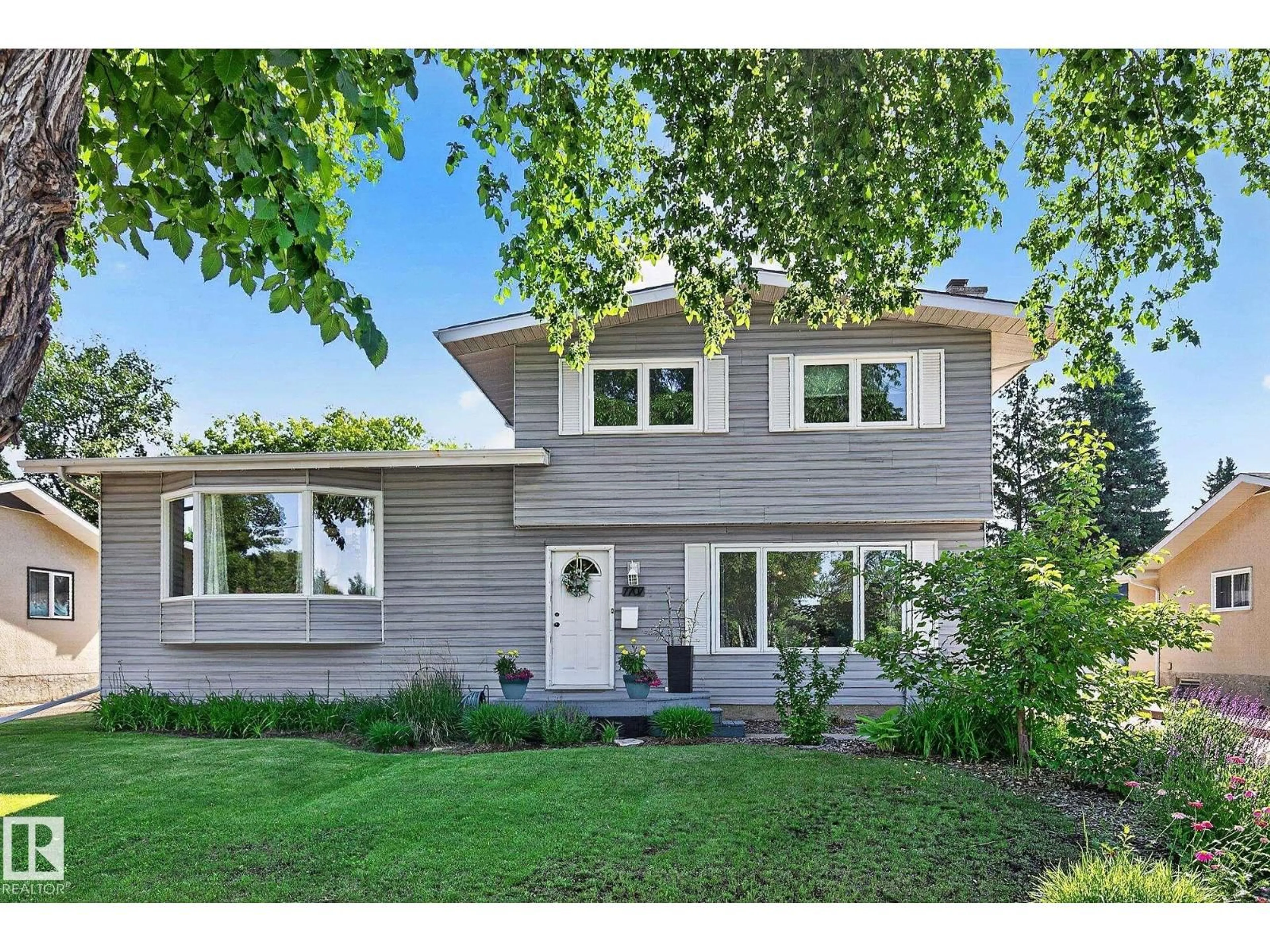 Home with vinyl exterior material, street for 7707 156 ST, Edmonton Alberta T5R1X6