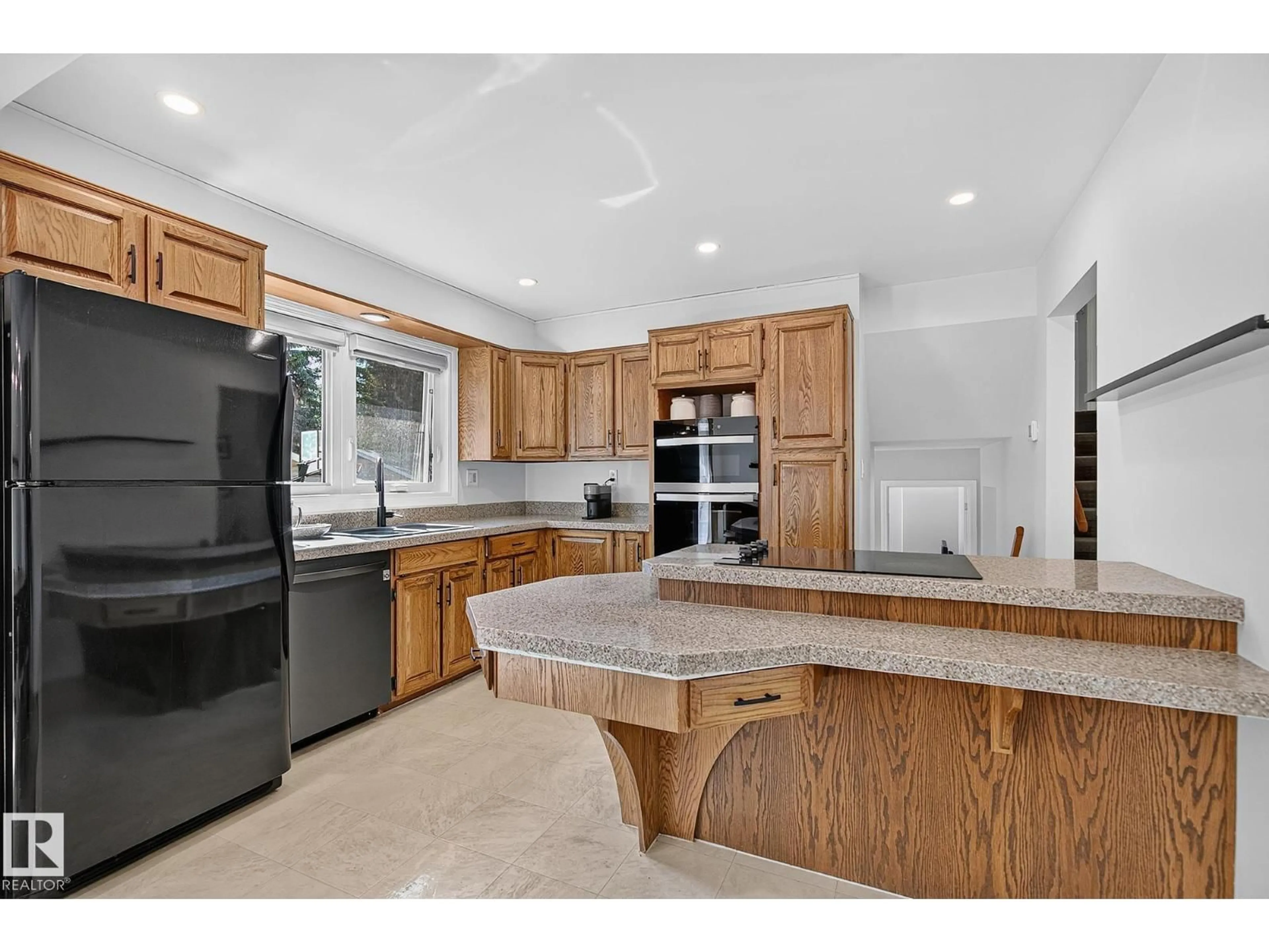 Open concept kitchen, ceramic/tile floor for 7707 156 ST, Edmonton Alberta T5R1X6