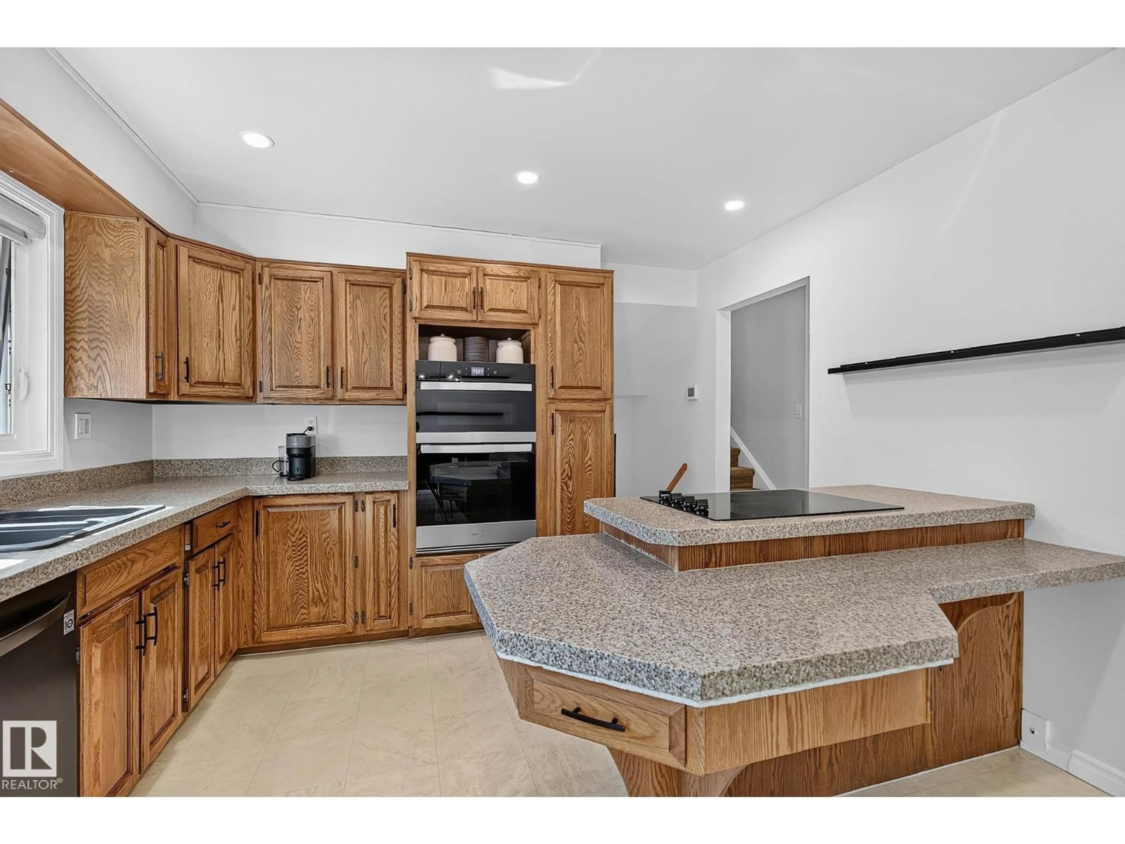 Open concept kitchen, ceramic/tile floor for 7707 156 ST, Edmonton Alberta T5R1X6