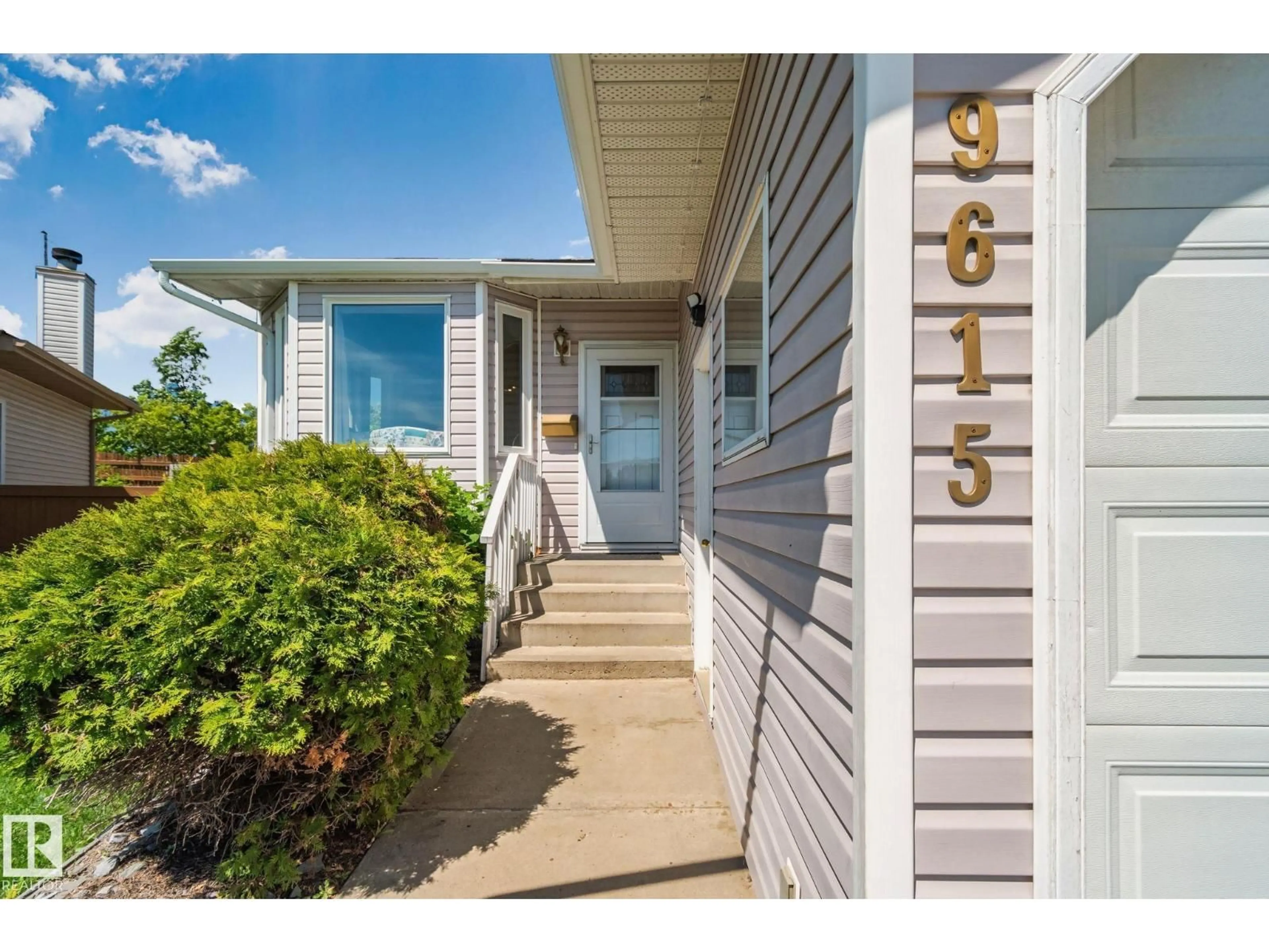 Home with vinyl exterior material, street for NW - 9615 175 AV, Edmonton Alberta T5Z2B7