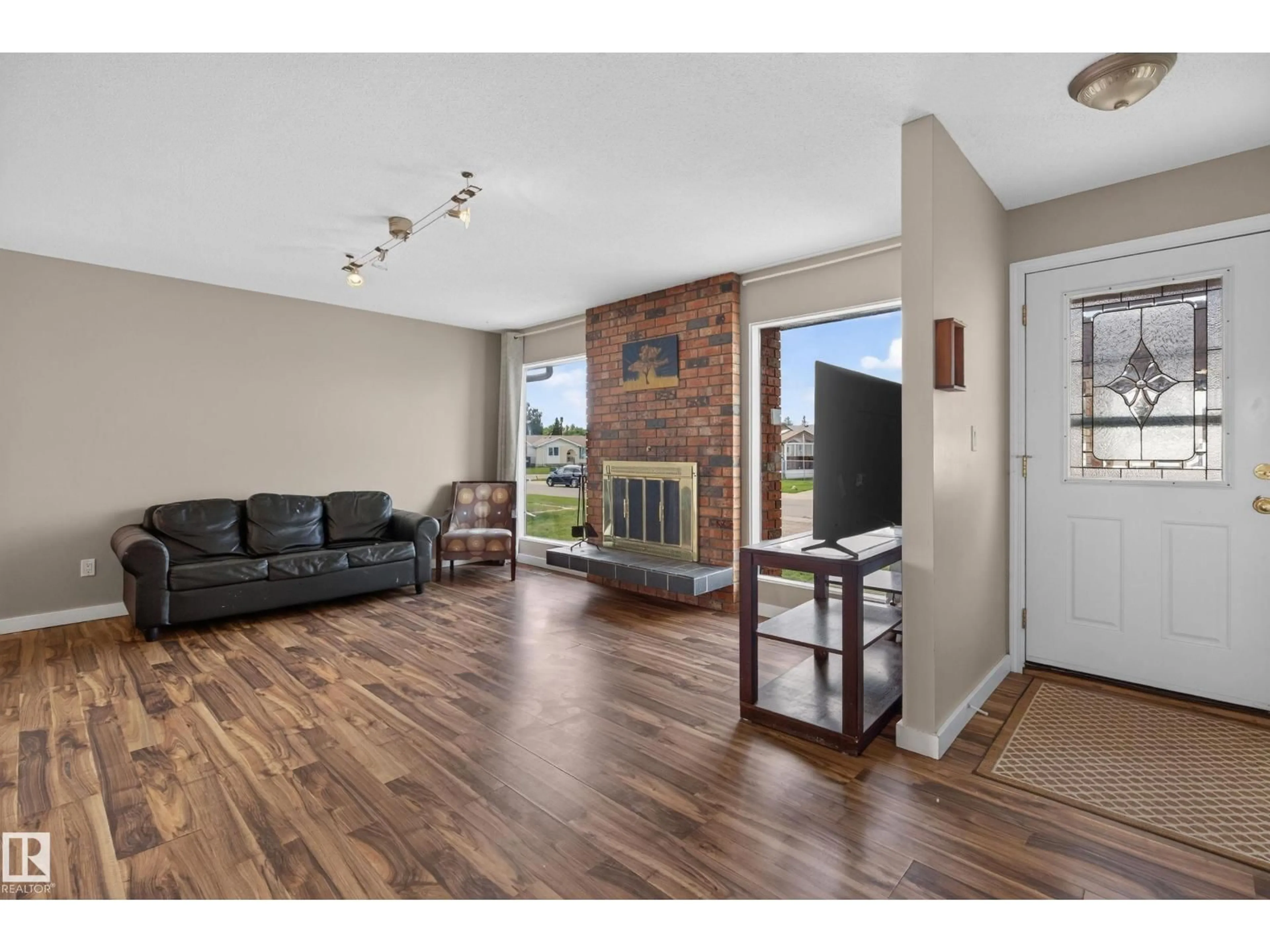 Living room with furniture, wood/laminate floor for 15231 117 ST, Edmonton Alberta T5X1R2