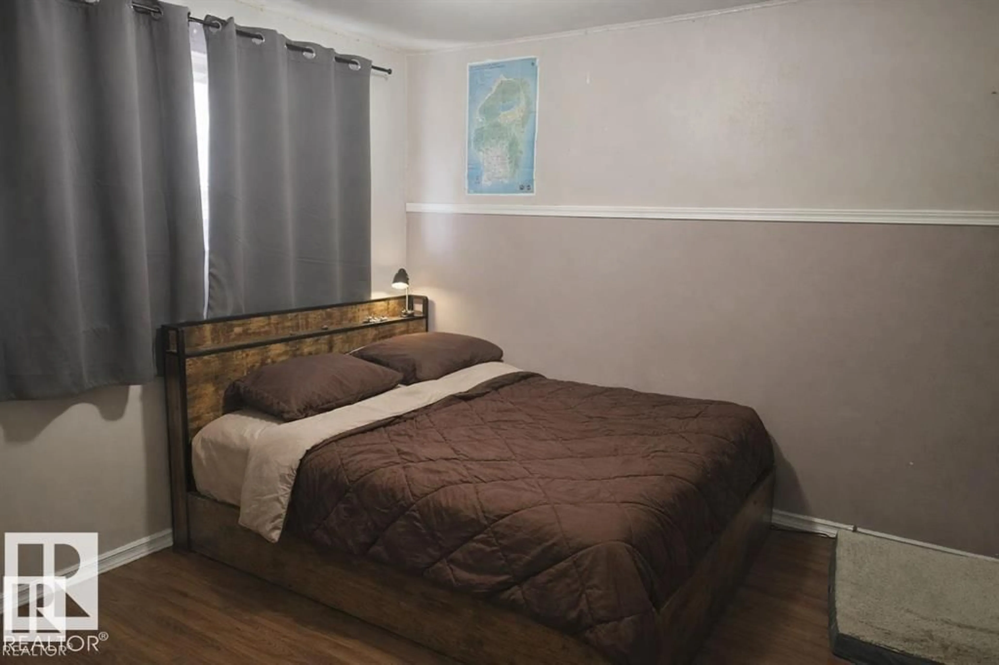 Bedroom with bed, wood/laminate floor for 13204 131A AV NW, Edmonton Alberta T5L3P2