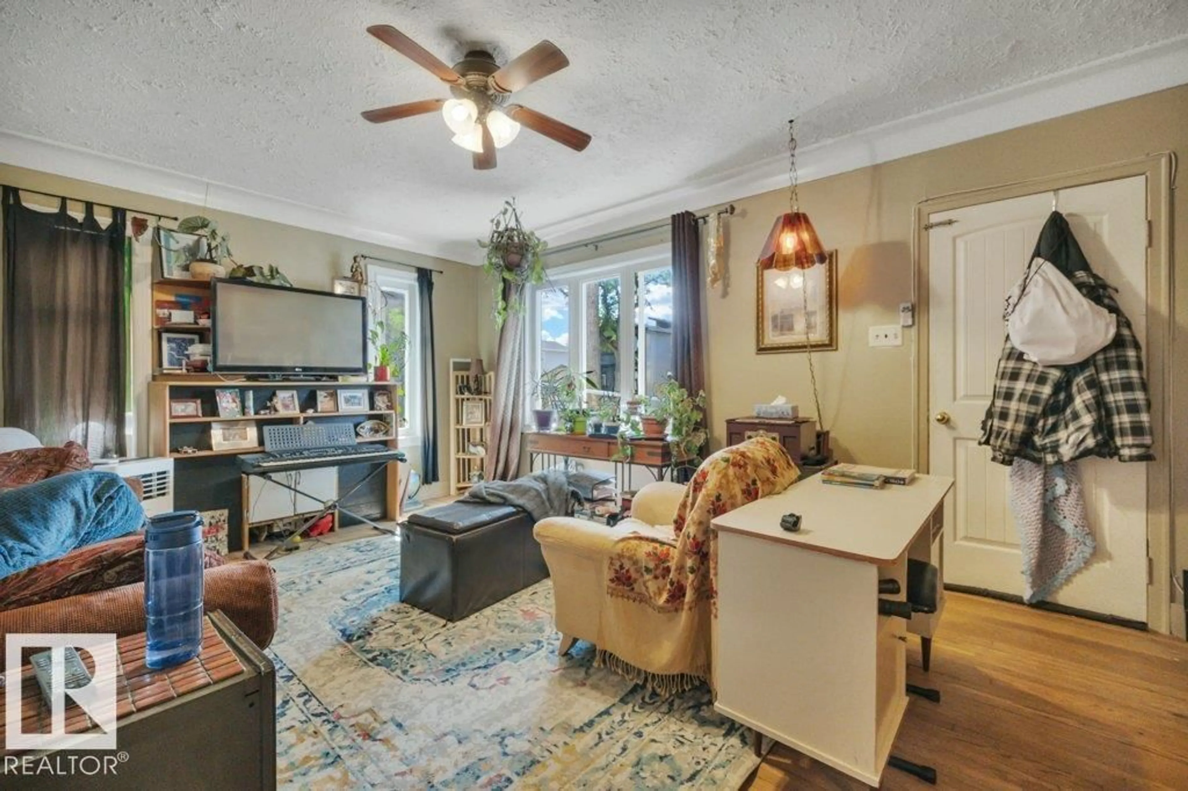 Living room with furniture, unknown for 12049 65 ST, Edmonton Alberta T5H2X6