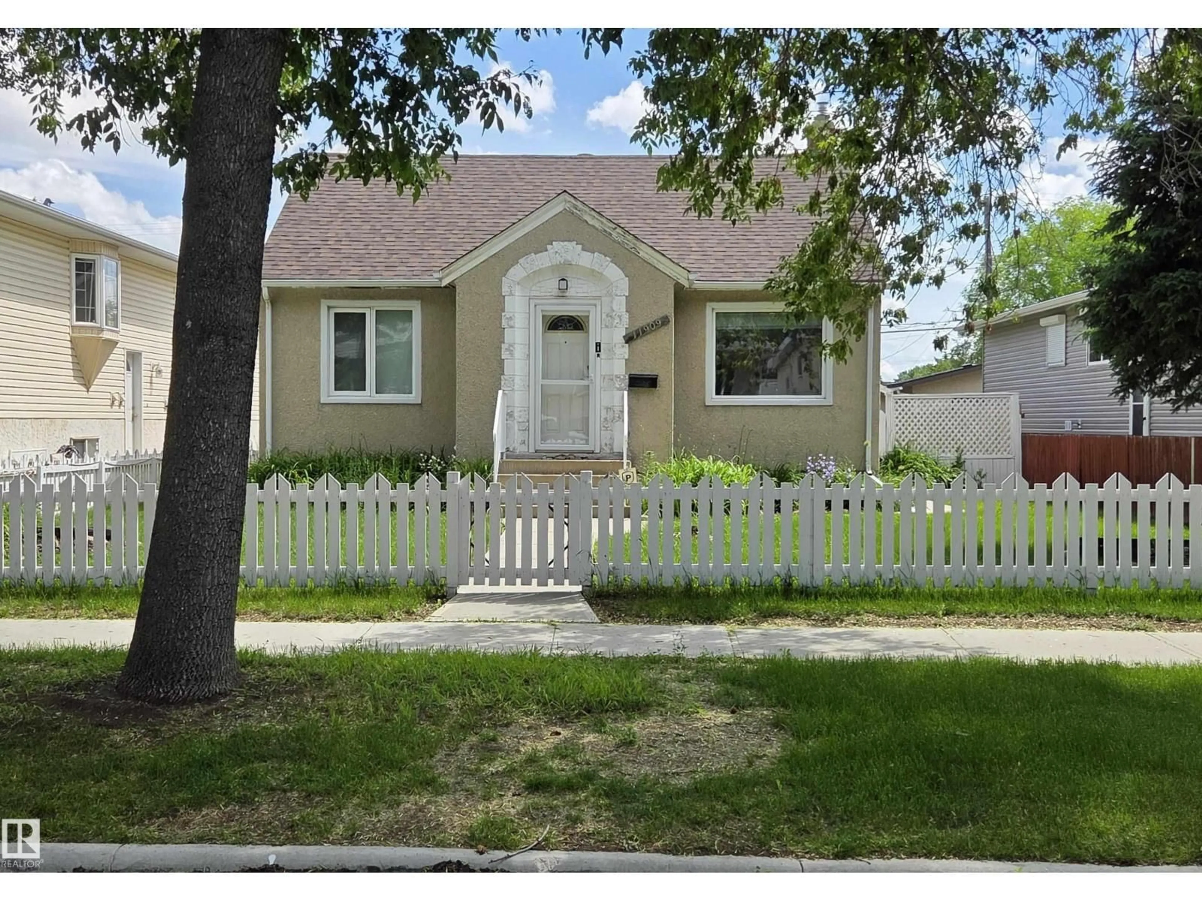 Home with vinyl exterior material, street for 11909 83 ST, Edmonton Alberta T5B4E7