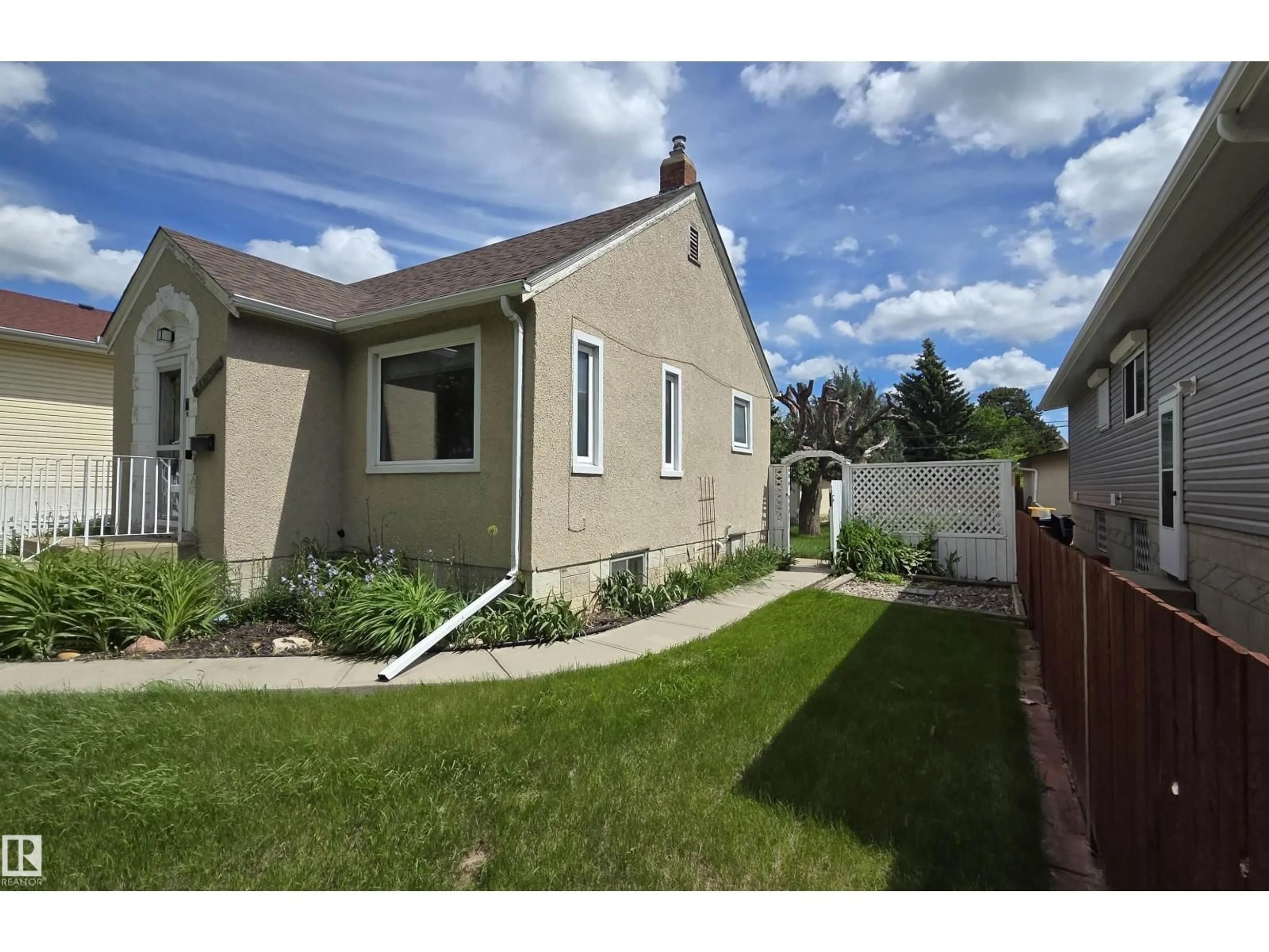 Home with vinyl exterior material, street for 11909 83 ST, Edmonton Alberta T5B4E7