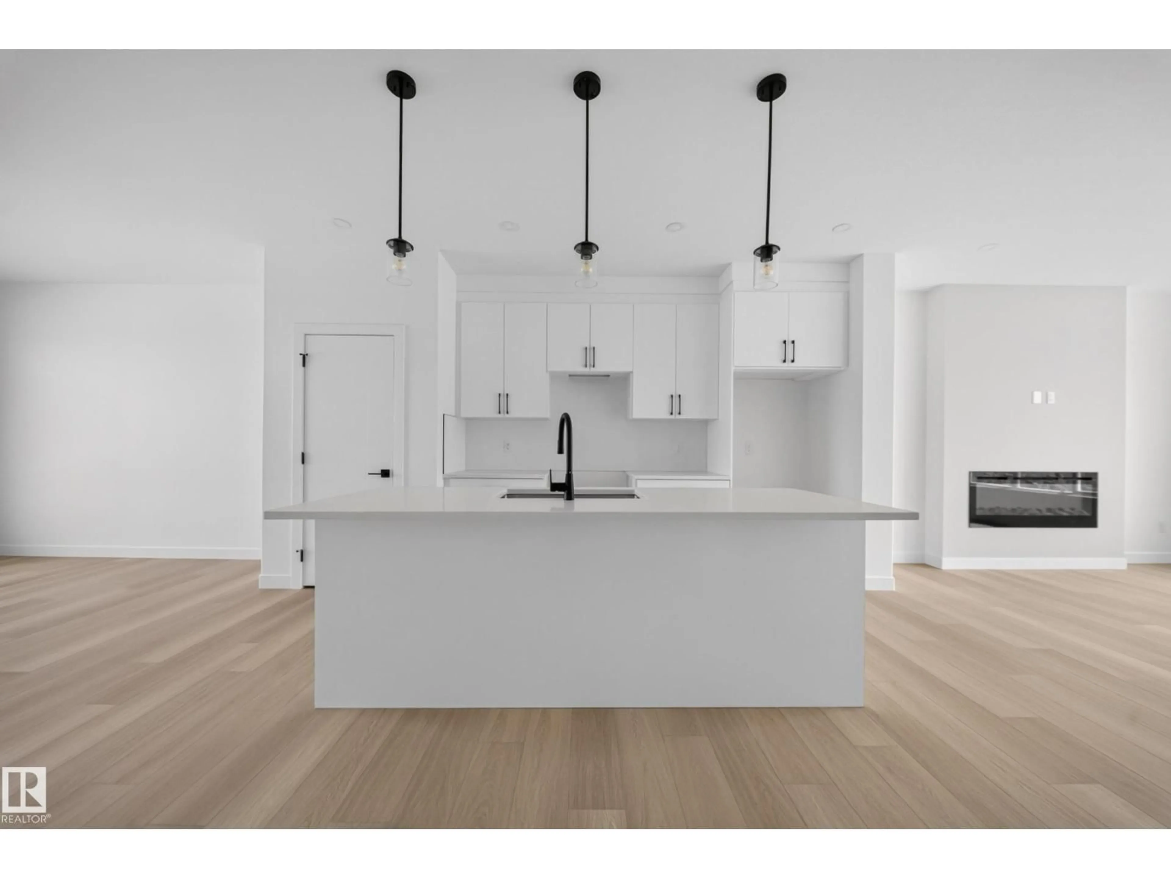Open concept kitchen, wood/laminate floor for 534 ASHGROVE CIRCLE, Leduc Alberta T9E0K8