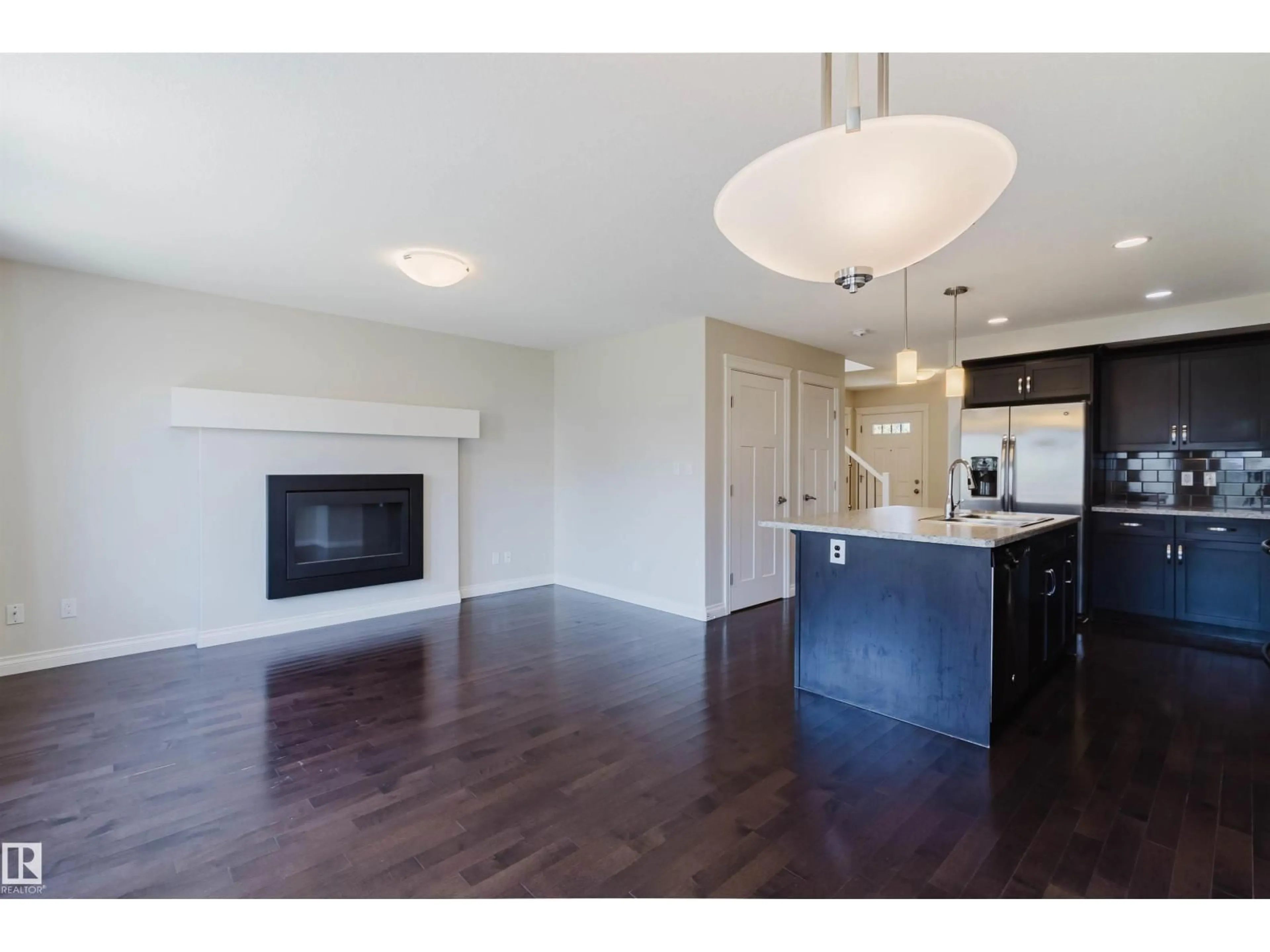 Open concept kitchen, wood/laminate floor for SW - 1131 177 ST, Edmonton Alberta T6W1Z9