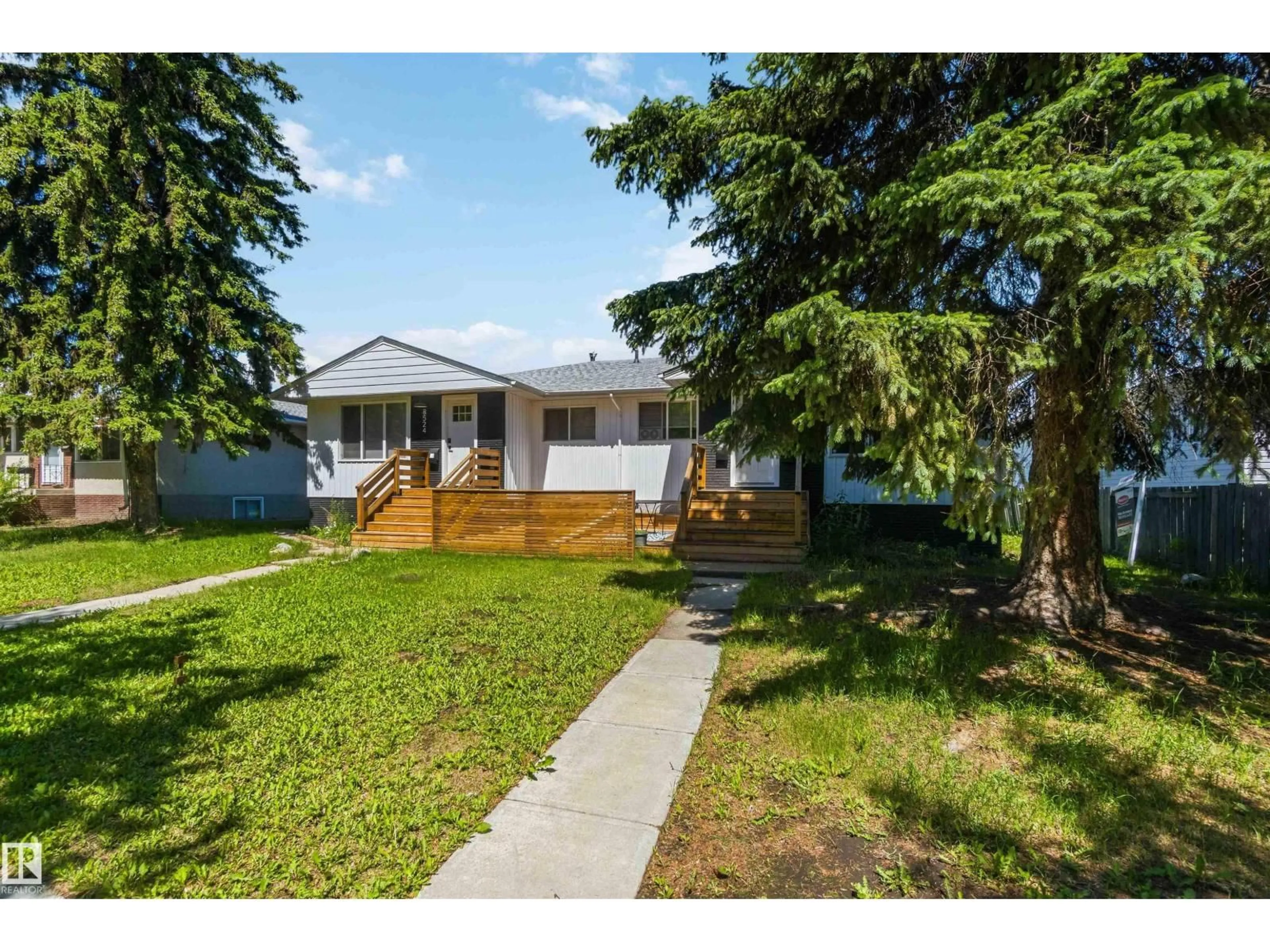 Home with vinyl exterior material, street for NW - 8522 8524 84 AV, Edmonton Alberta T6C1C9