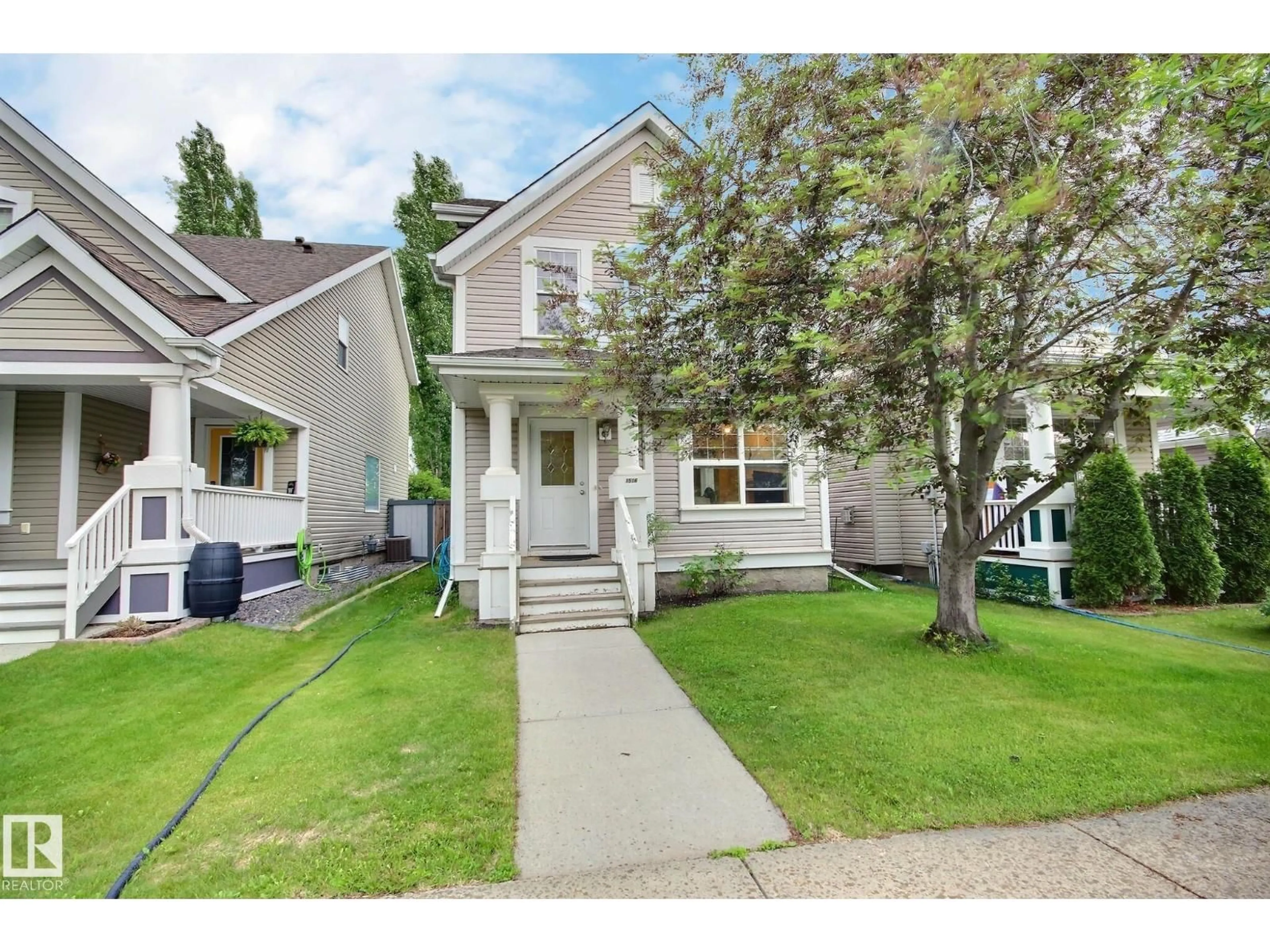 Home with vinyl exterior material, street for 1516 76 ST, Edmonton Alberta T6X1M3