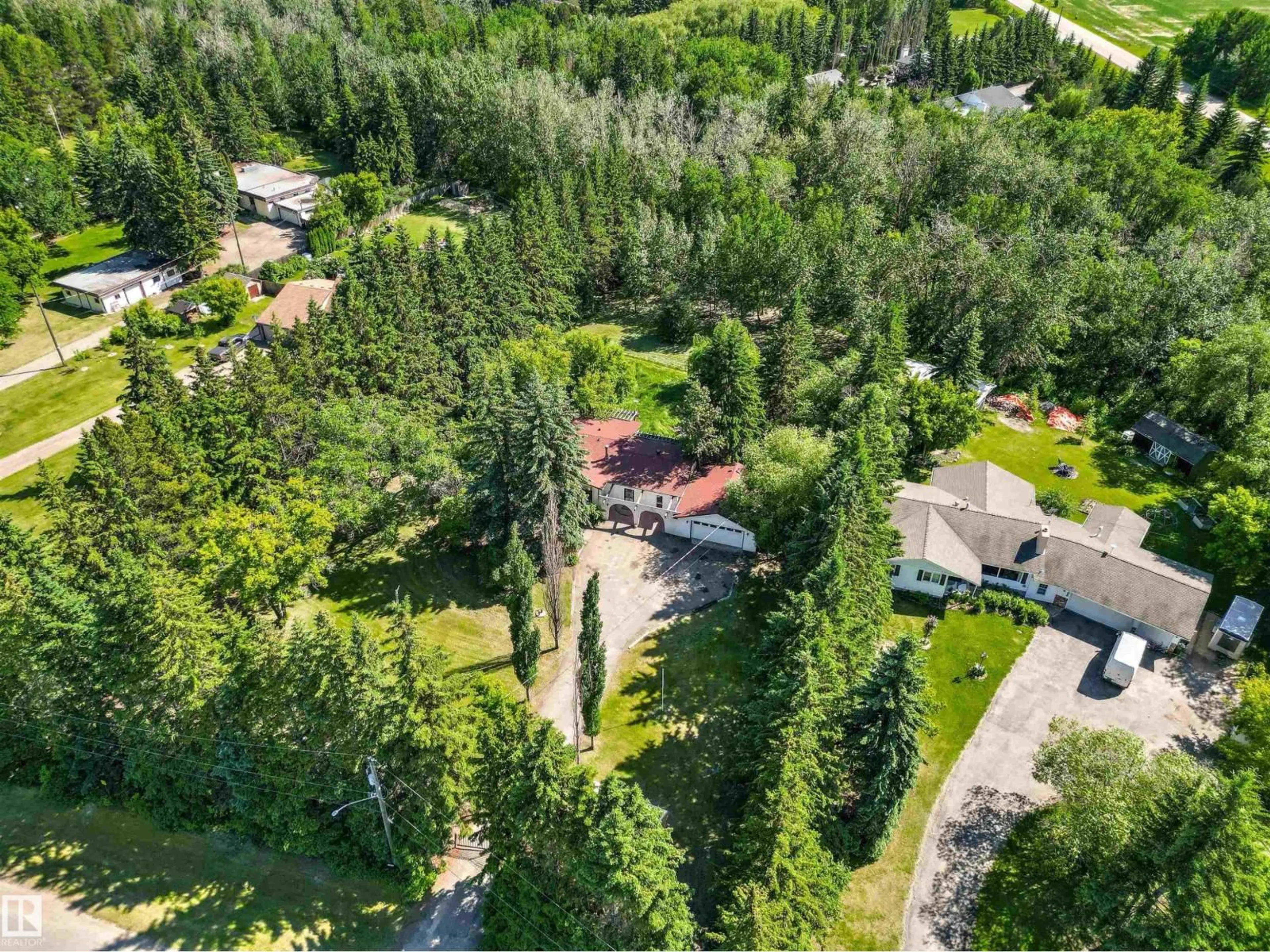 A pic from outside/outdoor area/front of a property/back of a property/a pic from drone, forest/trees view for 107 GRANDISLE RD, Edmonton Alberta T6M2P1