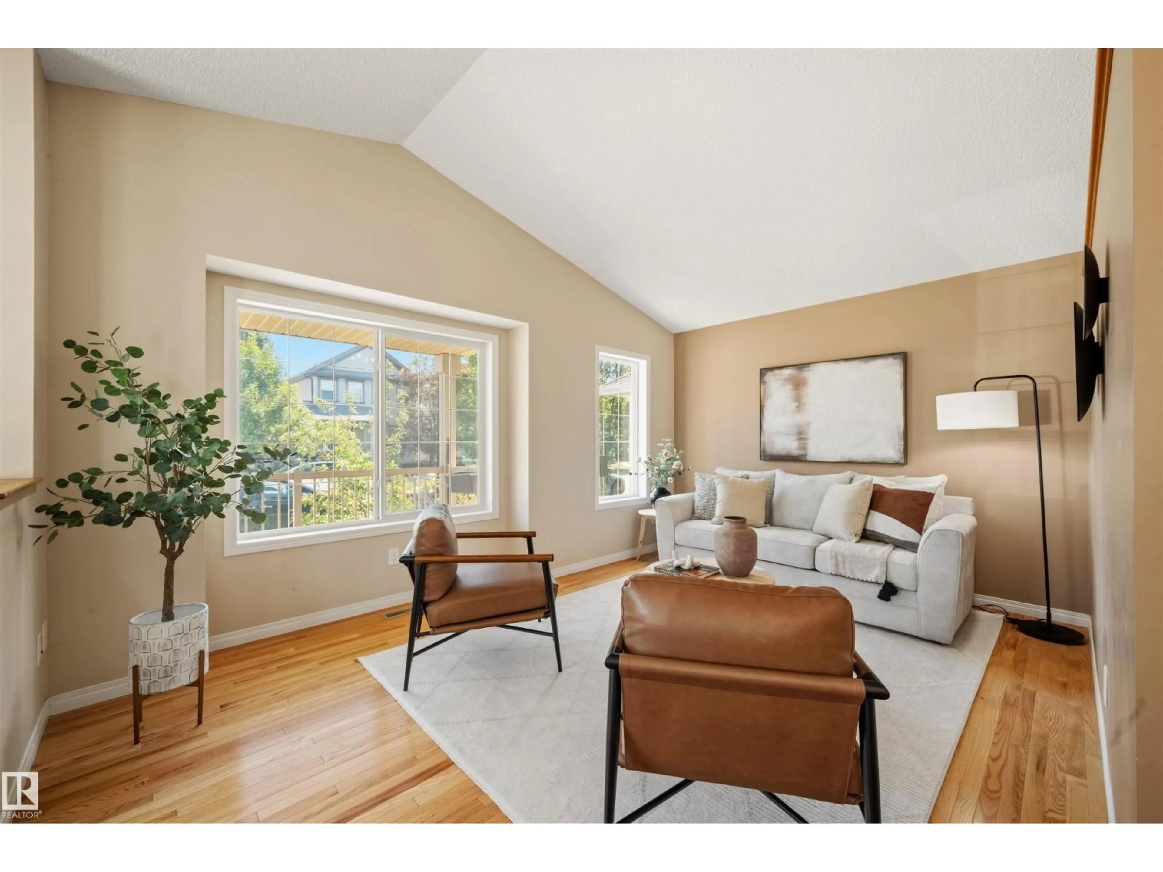 Living room with furniture, wood/laminate floor for 7838 SCHMID PL, Edmonton Alberta T6R0K5