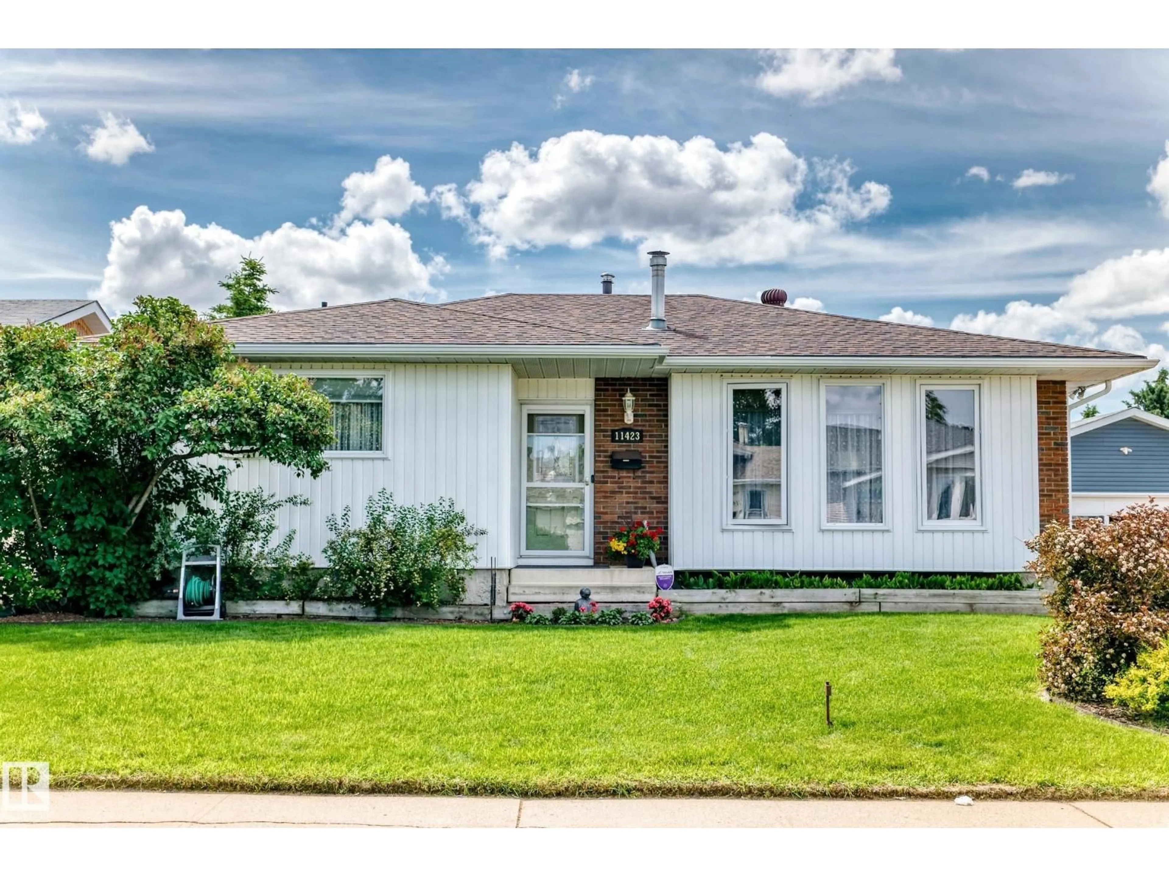 Home with vinyl exterior material, street for 11423 161 AV, Edmonton Alberta T5X2K9