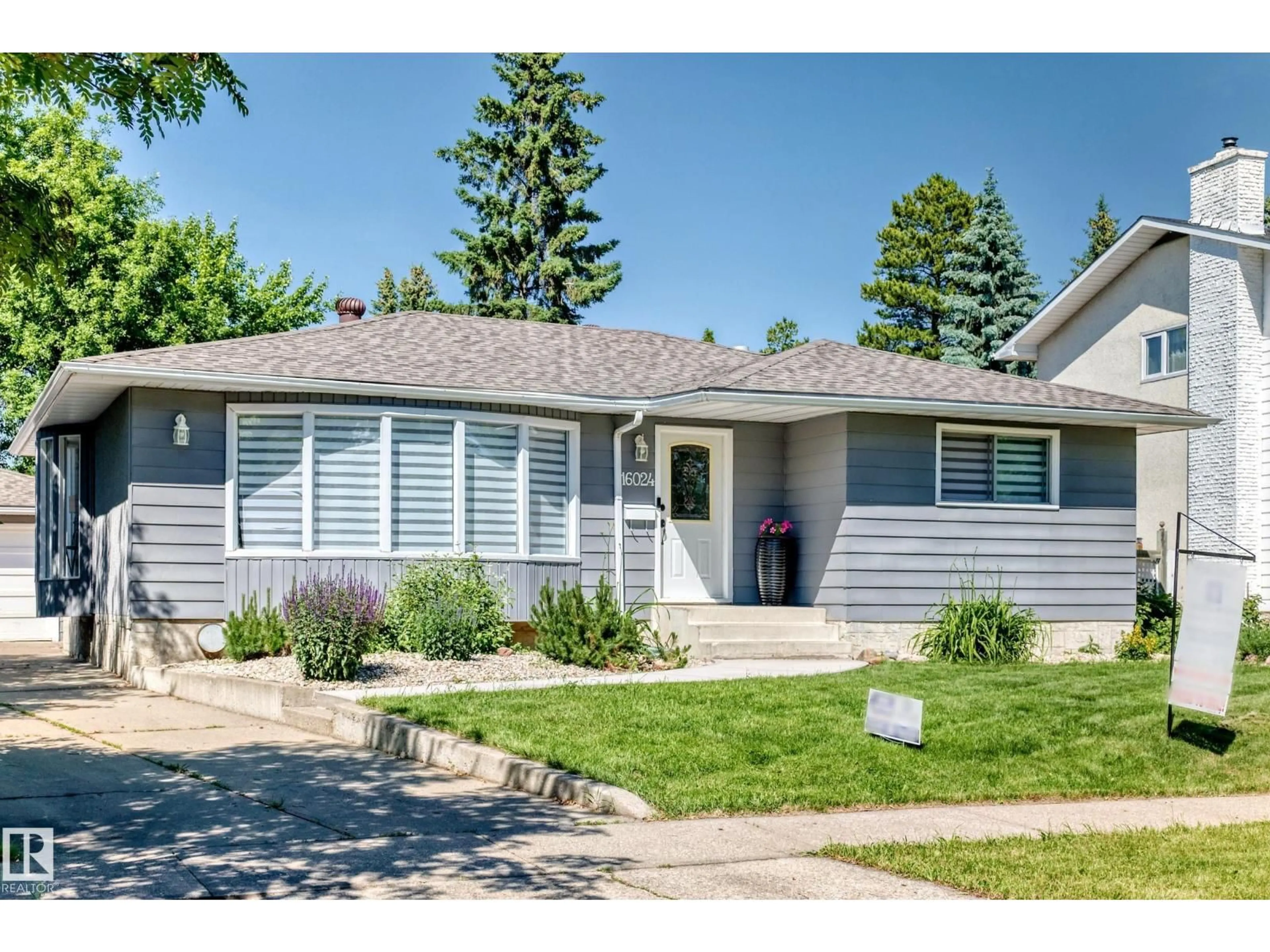 Home with vinyl exterior material, street for 16024 78 AV, Edmonton Alberta T5R3E4