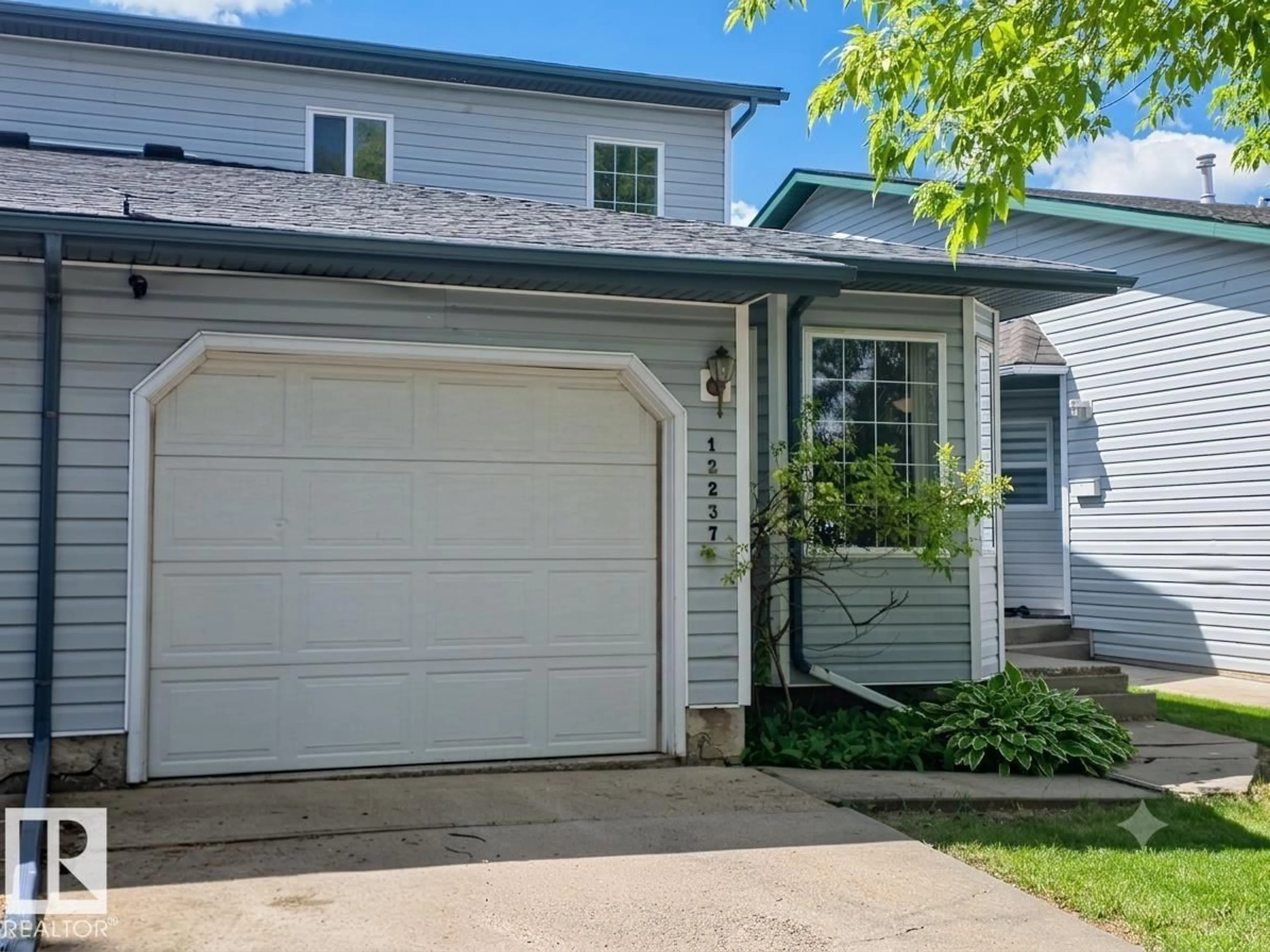 Home with vinyl exterior material, street for 12237 140A AV, Edmonton Alberta T5X6E6