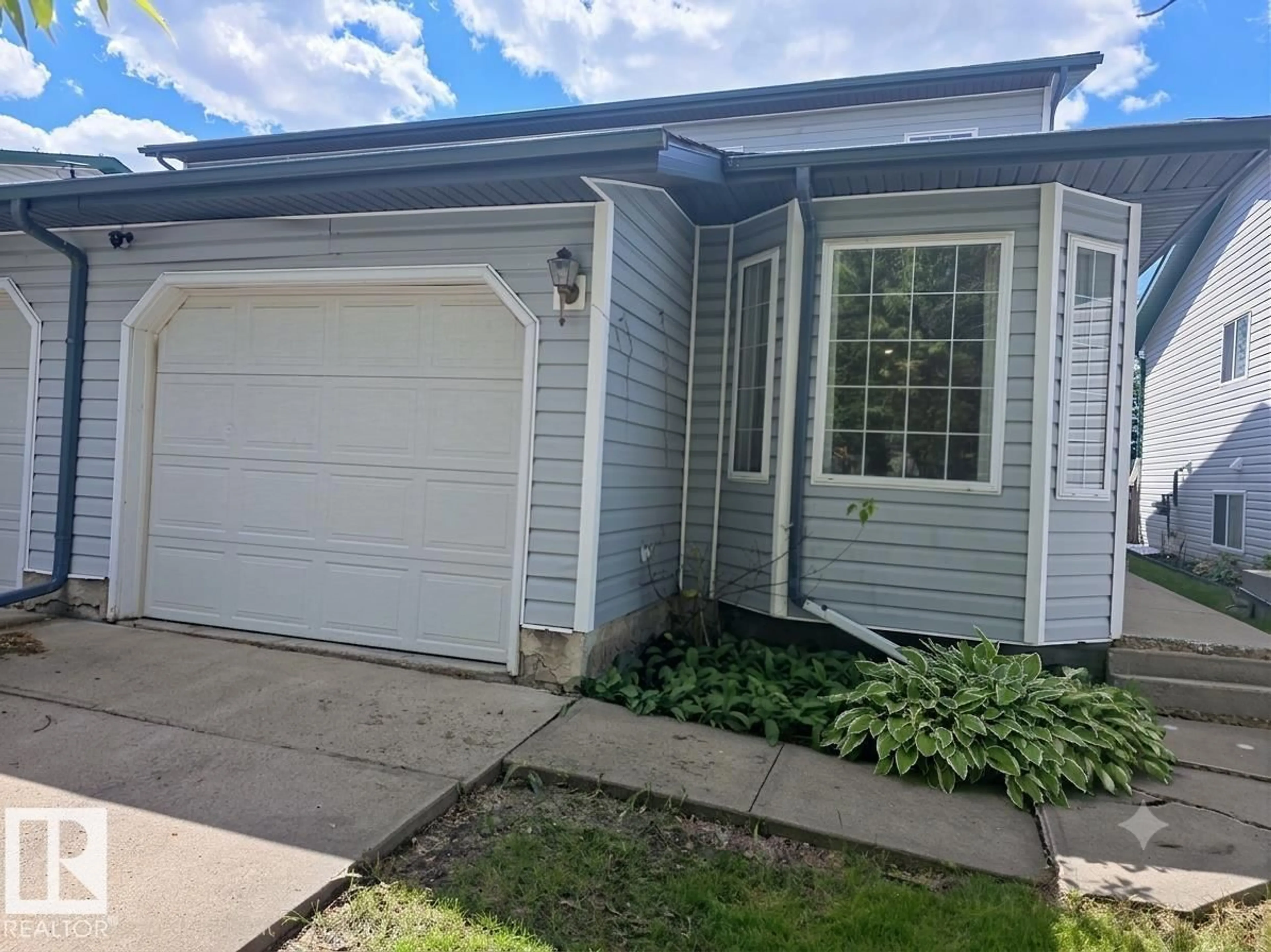 Home with vinyl exterior material, street for 12237 140A AV, Edmonton Alberta T5X6E6