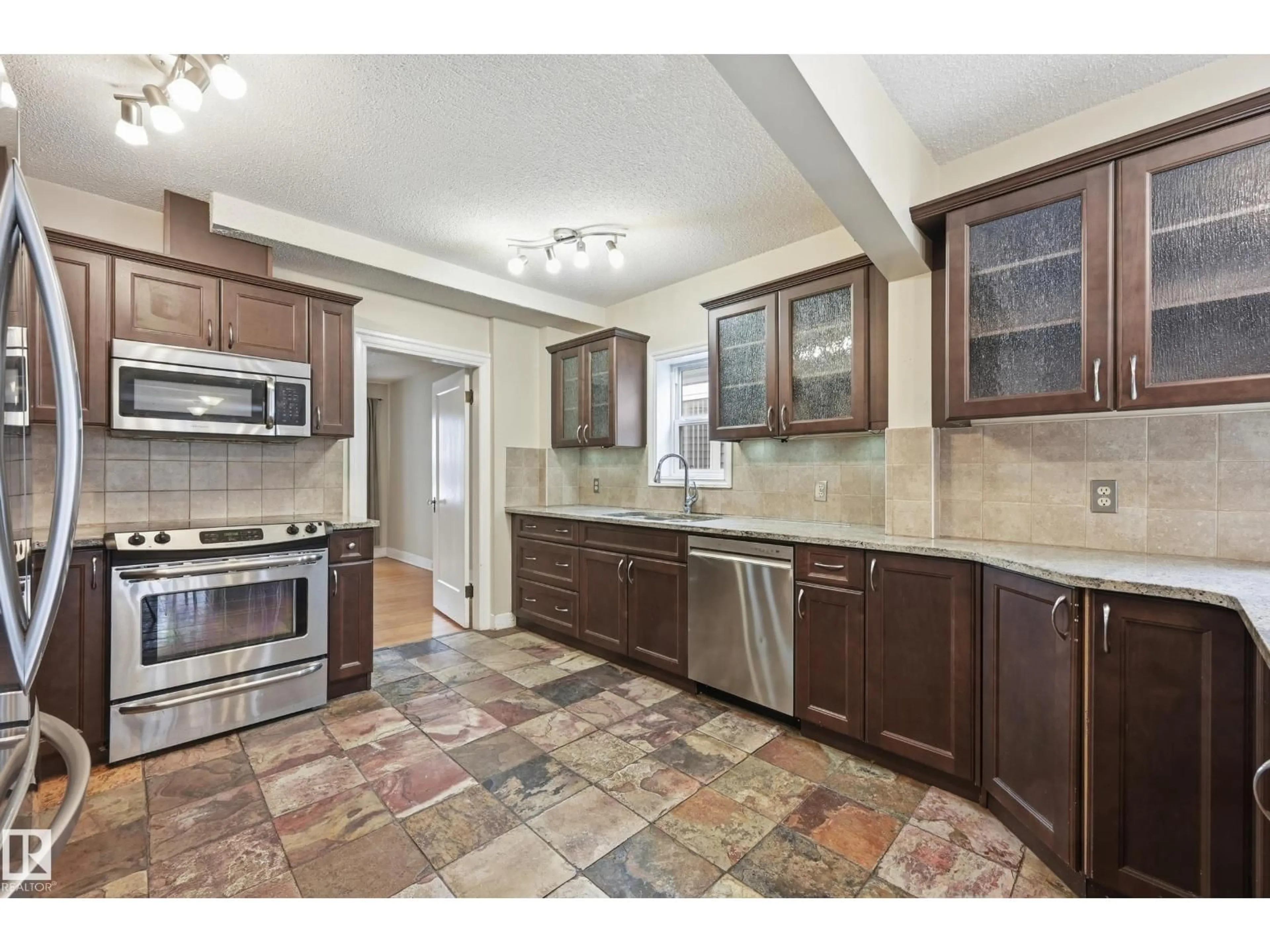 Open concept kitchen, ceramic/tile floor for NW - 11019 126 ST, Edmonton Alberta T5M0P8