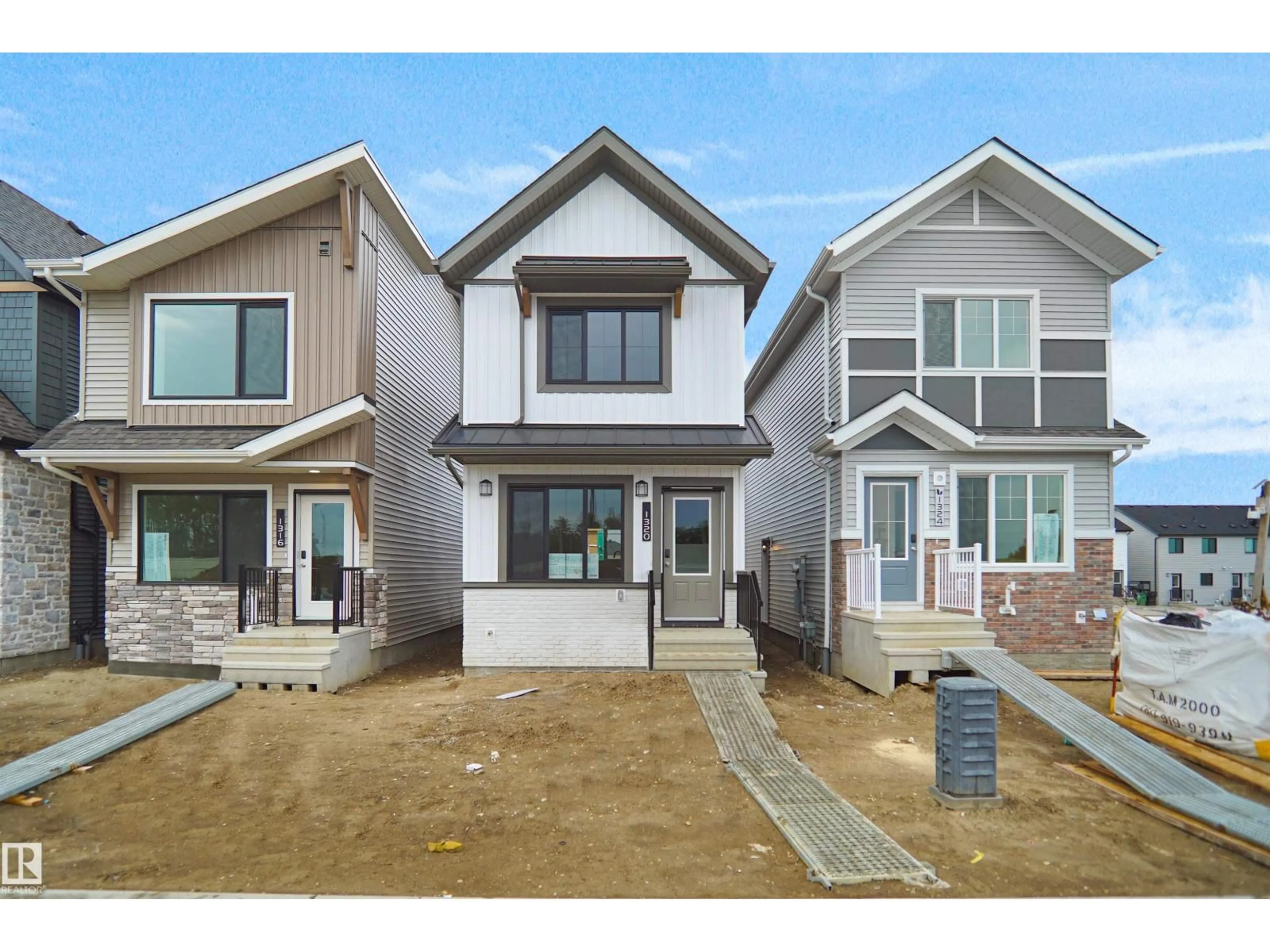 Home with vinyl exterior material, street for NW - 1320 9 ST, Edmonton Alberta T6T2W2