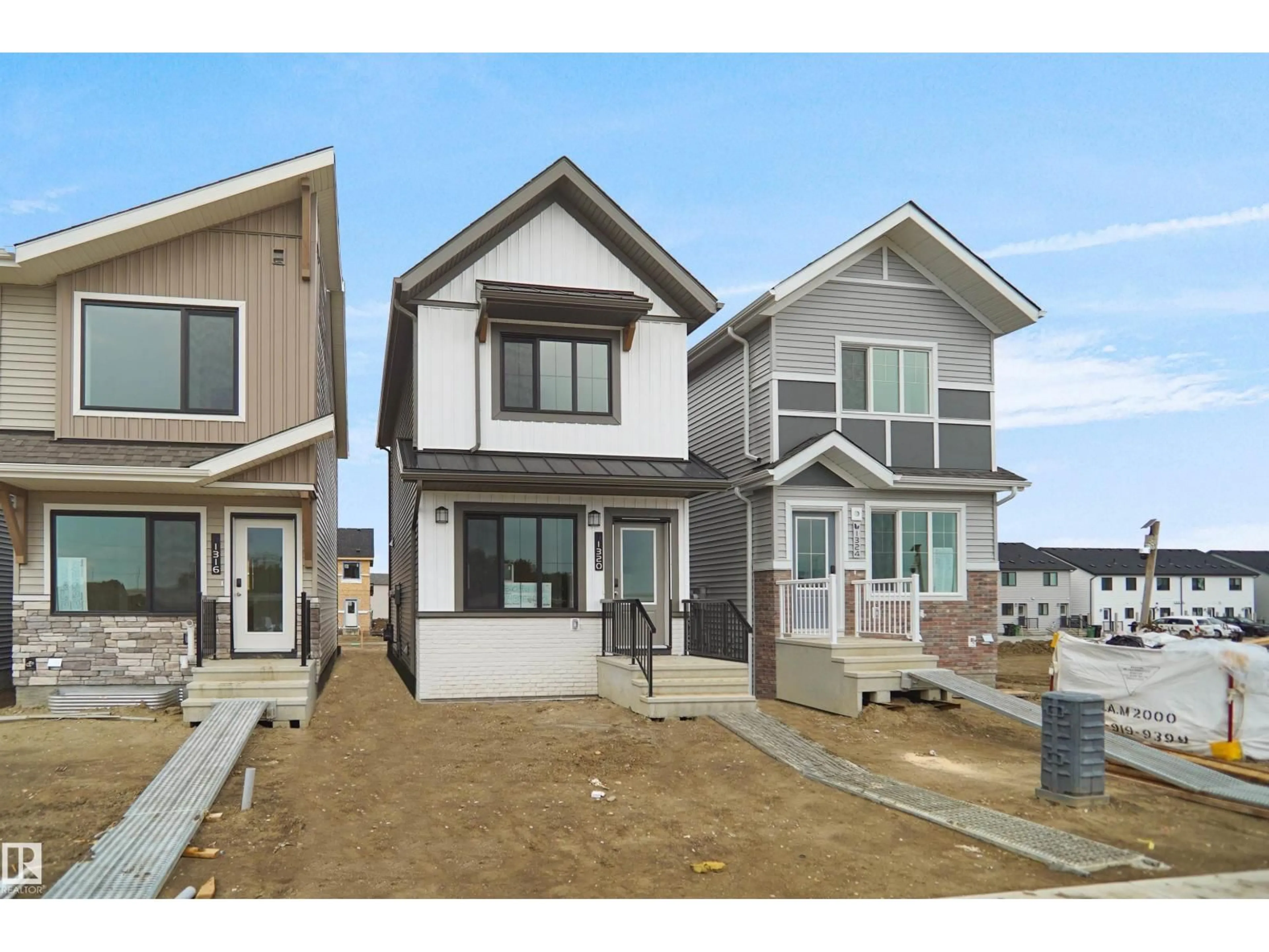 Home with vinyl exterior material, street for NW - 1320 9 ST, Edmonton Alberta T6T2W2