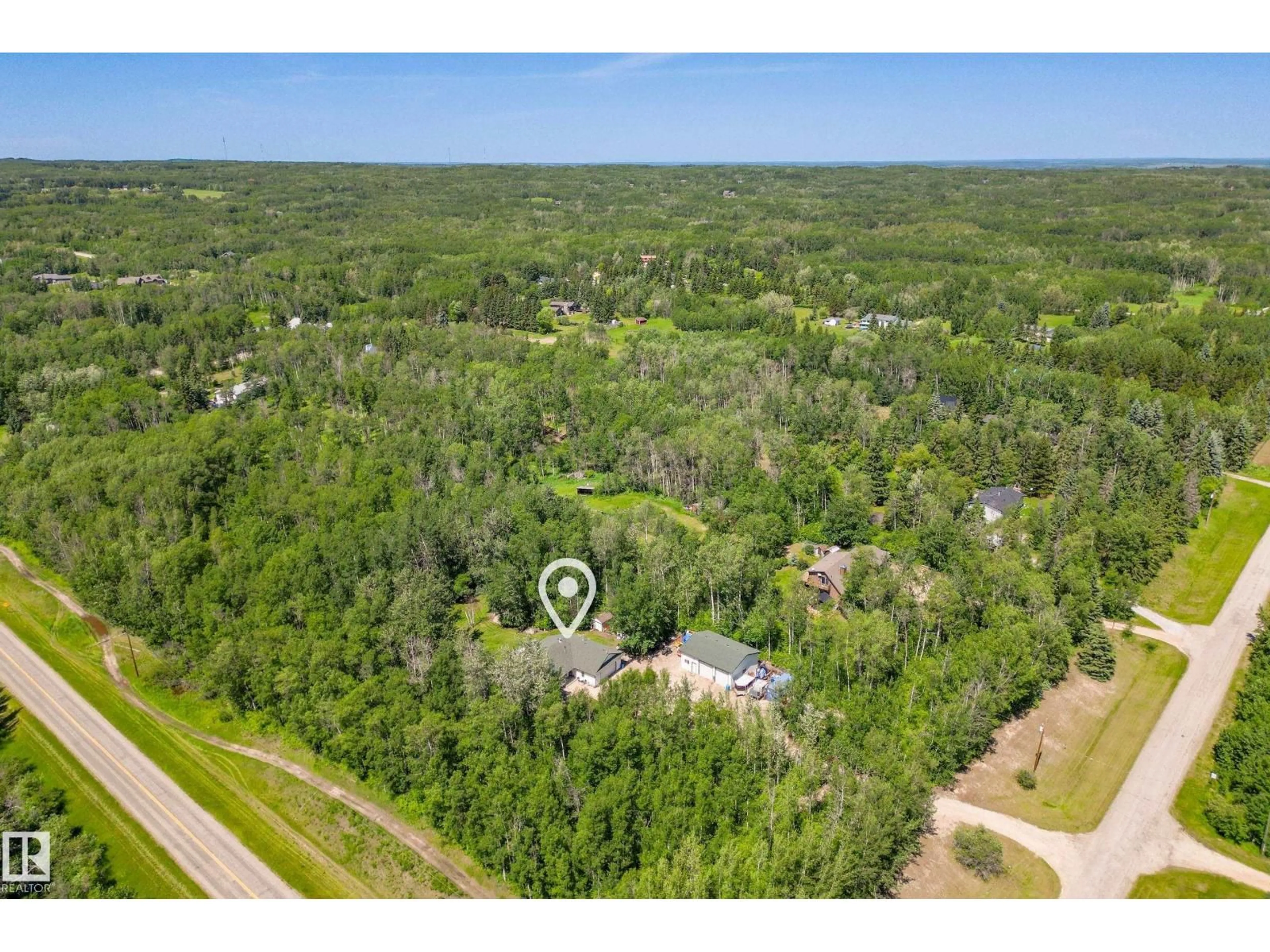 A pic from outside/outdoor area/front of a property/back of a property/a pic from drone, forest/trees view for #2 - 27420 TWP ROAD 540, Rural Parkland County Alberta T7X3S7
