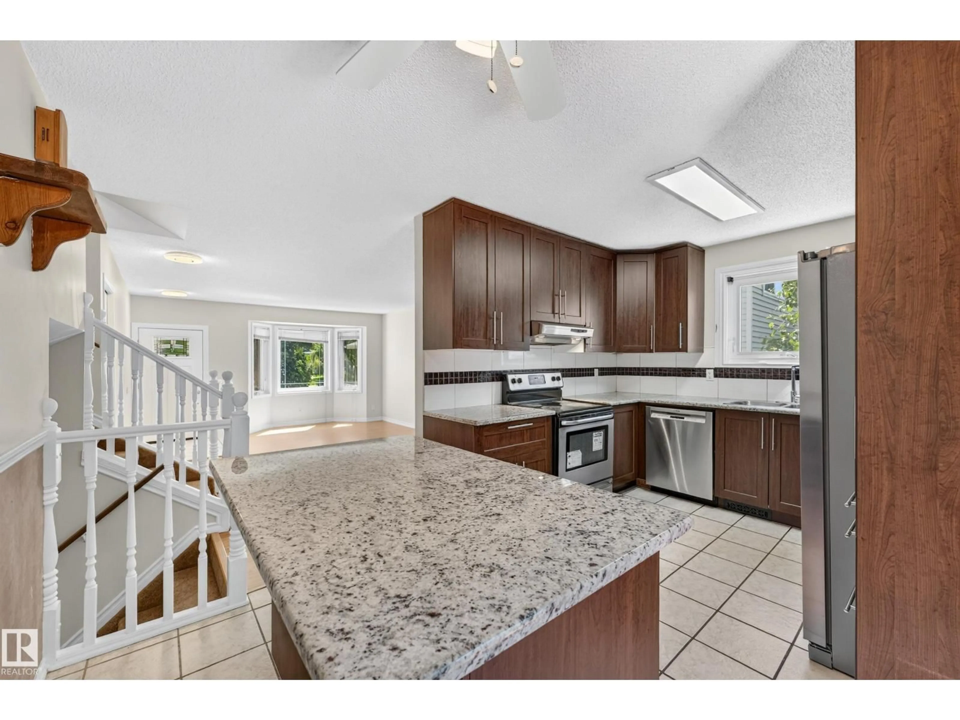 Open concept kitchen, ceramic/tile floor for 10332 21 AV, Edmonton Alberta T6J6B6