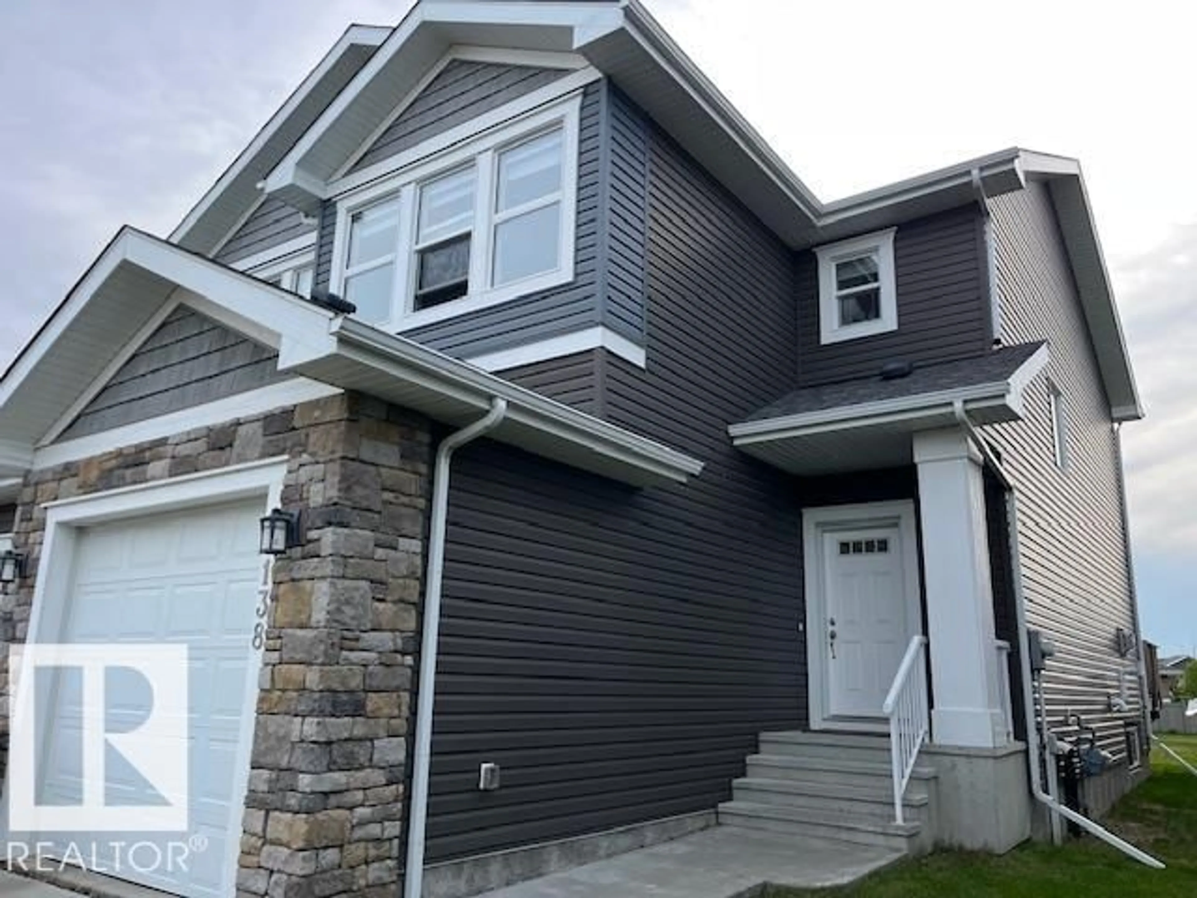 Home with vinyl exterior material, street for 138 REED PL, Leduc Alberta T9E1B1