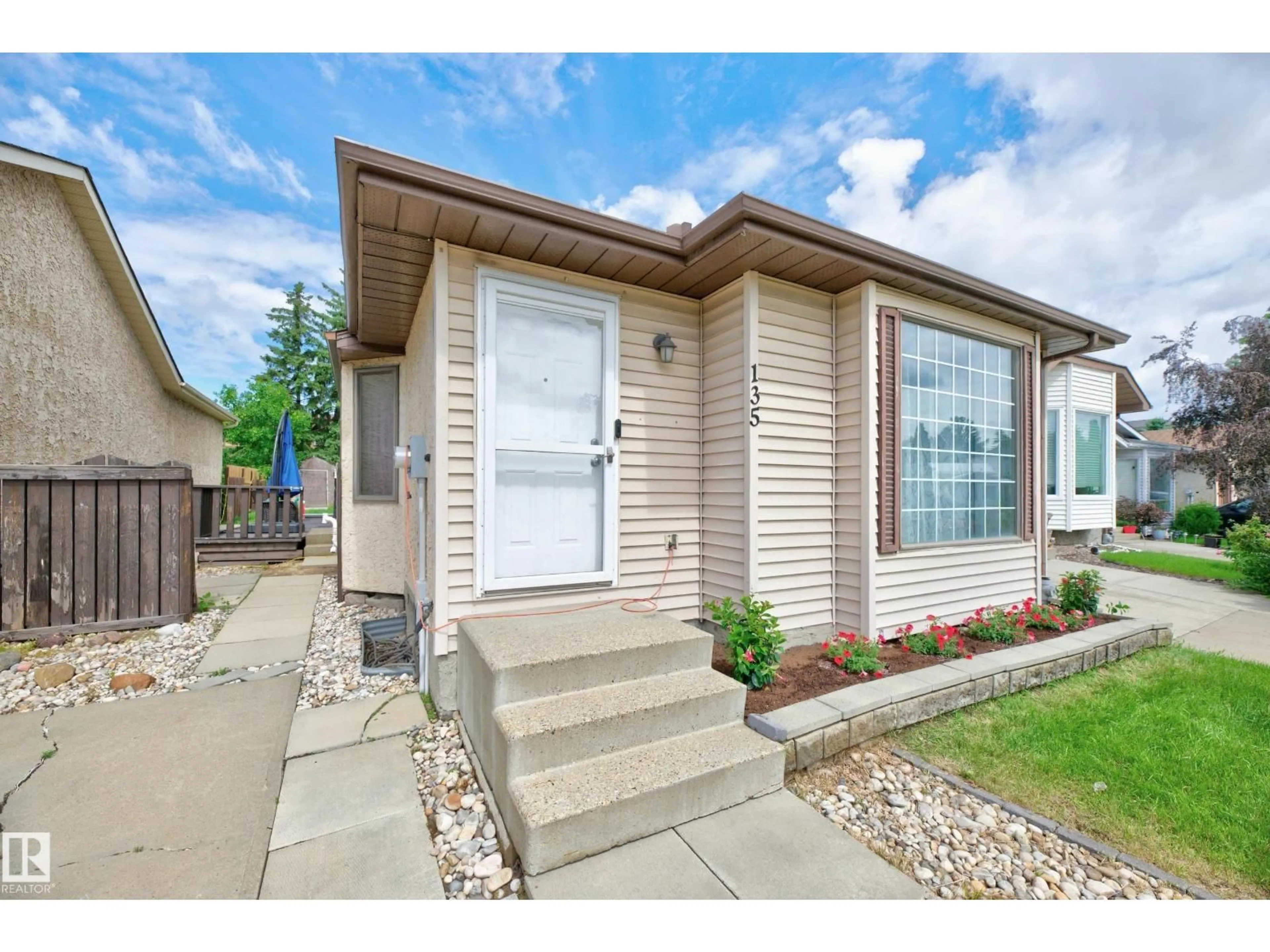 Home with vinyl exterior material, street for 135 HYNDMAN CR, Edmonton Alberta T5A4X6