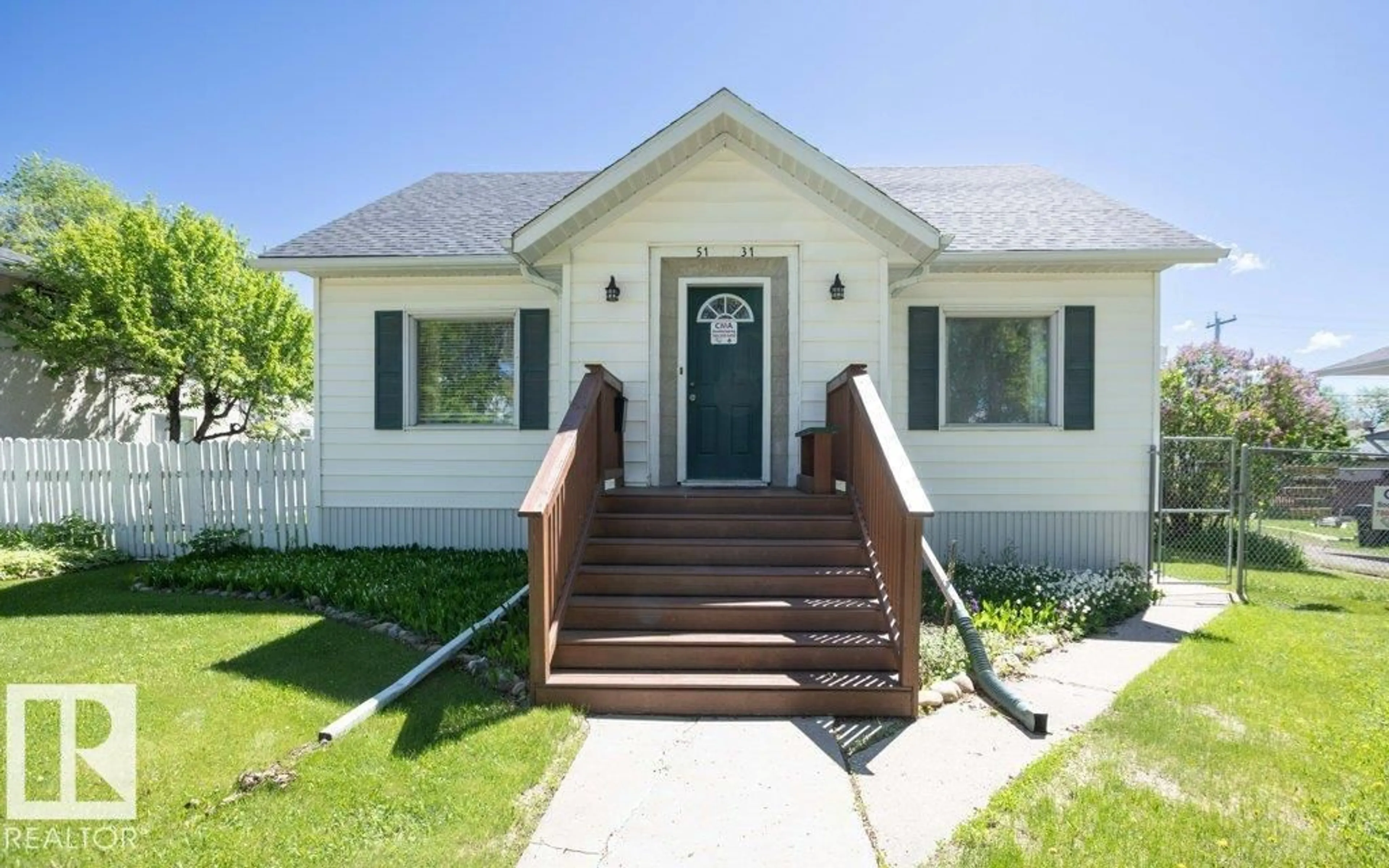 Home with vinyl exterior material, street for 5131 52 ST, Barrhead Alberta T7N1E9