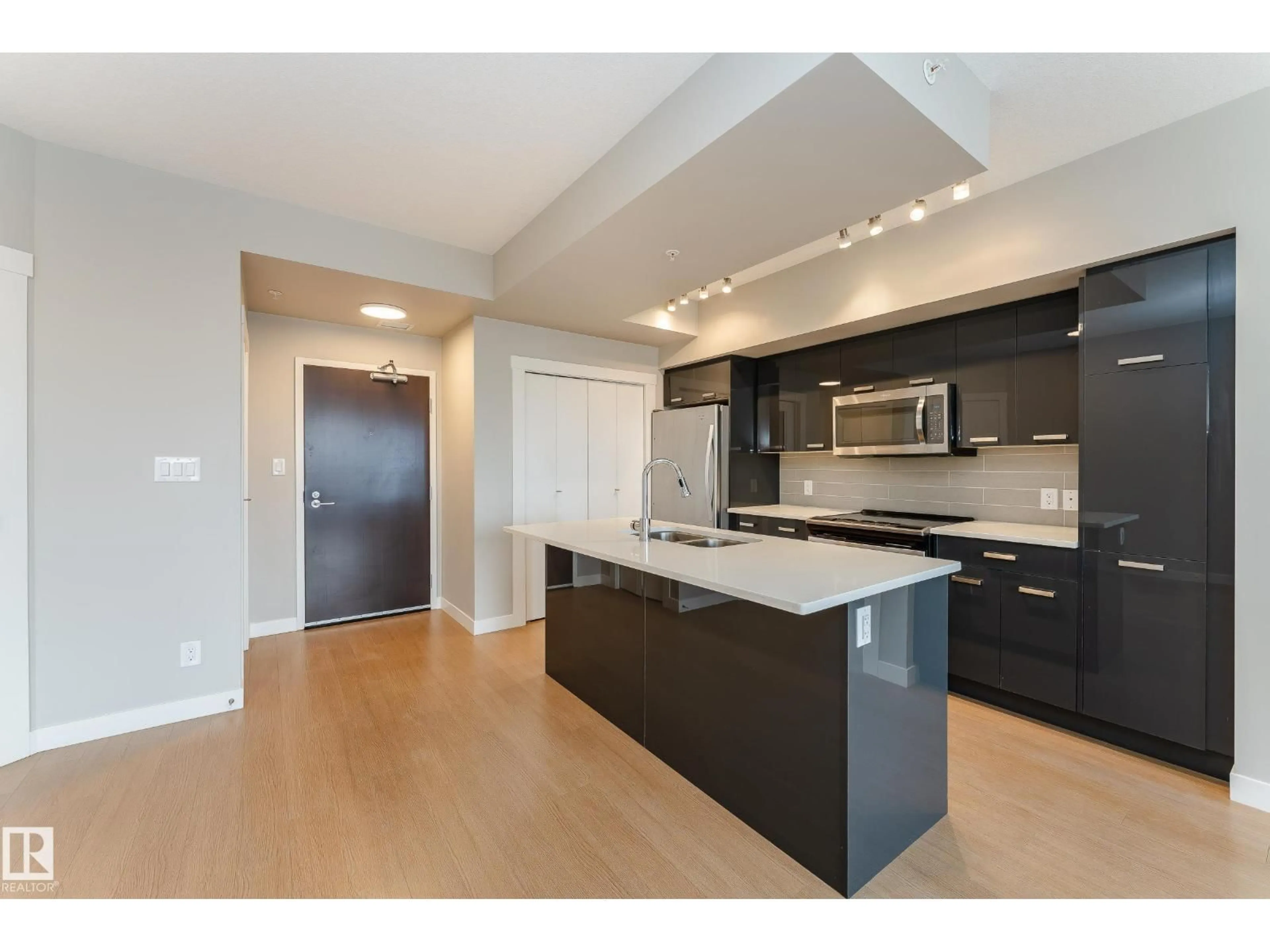 Open concept kitchen, wood/laminate floor for 1105 10410 102 NW, Edmonton Alberta T5J0E9