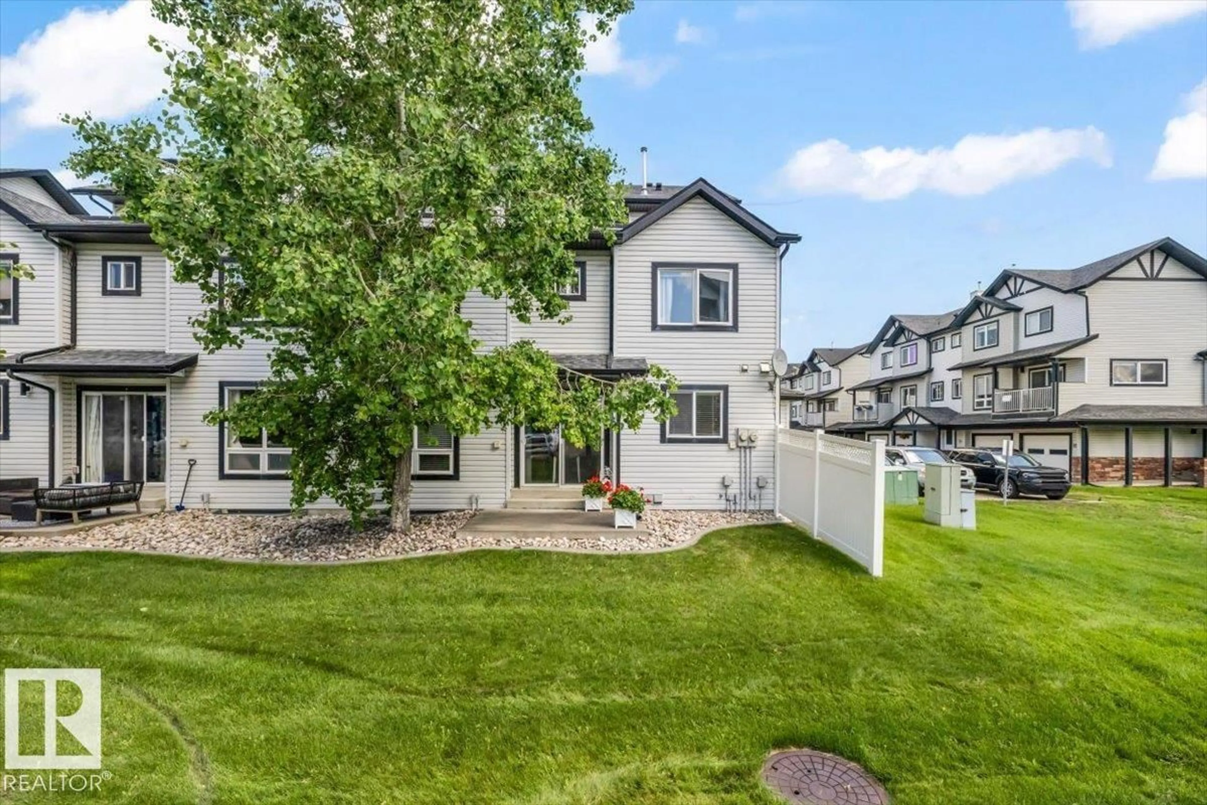 A pic from outside/outdoor area/front of a property/back of a property/a pic from drone, mountain view for 11 - 75 CLOVER BAR LN, Sherwood Park Alberta T8H0C4