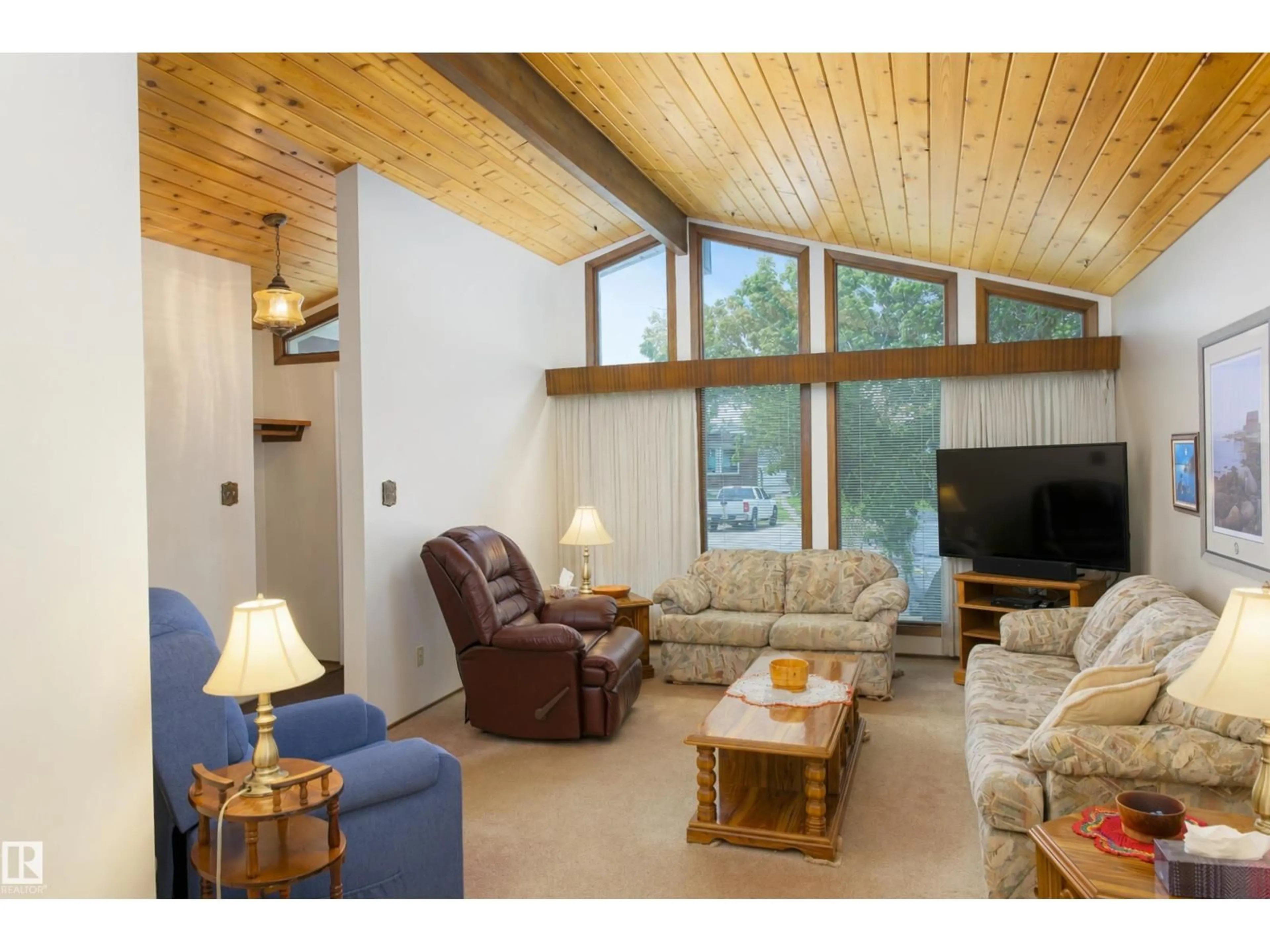 Living room with furniture, wood/laminate floor for 4906 43A ST, Barrhead Alberta T0G0E0